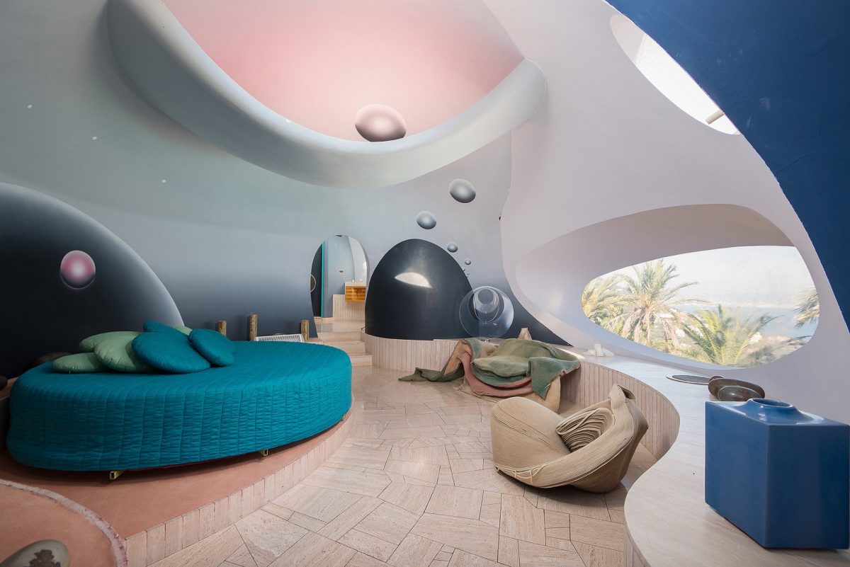 bedroom with a round bed and drawn on bubbles on the walls