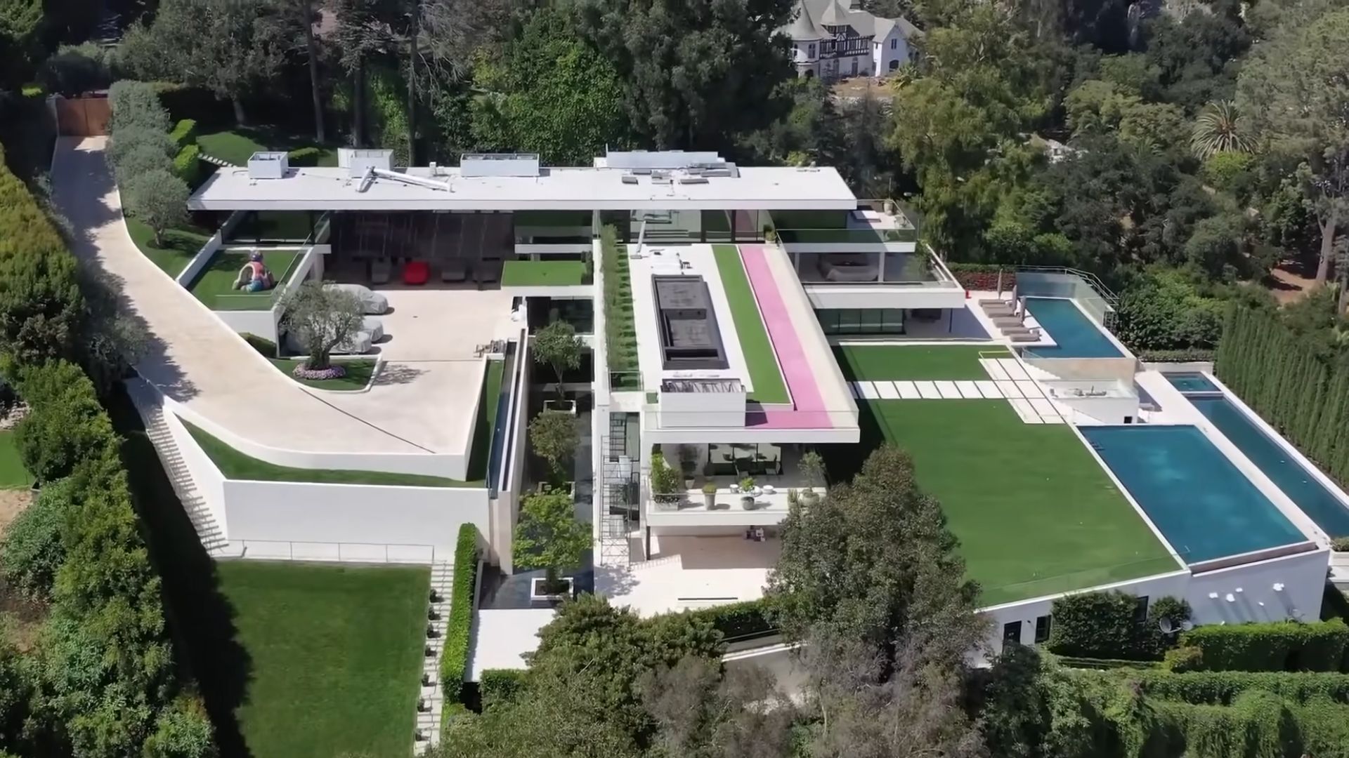 beyonce and jay-z's mega mansion with four pools, built in cascades