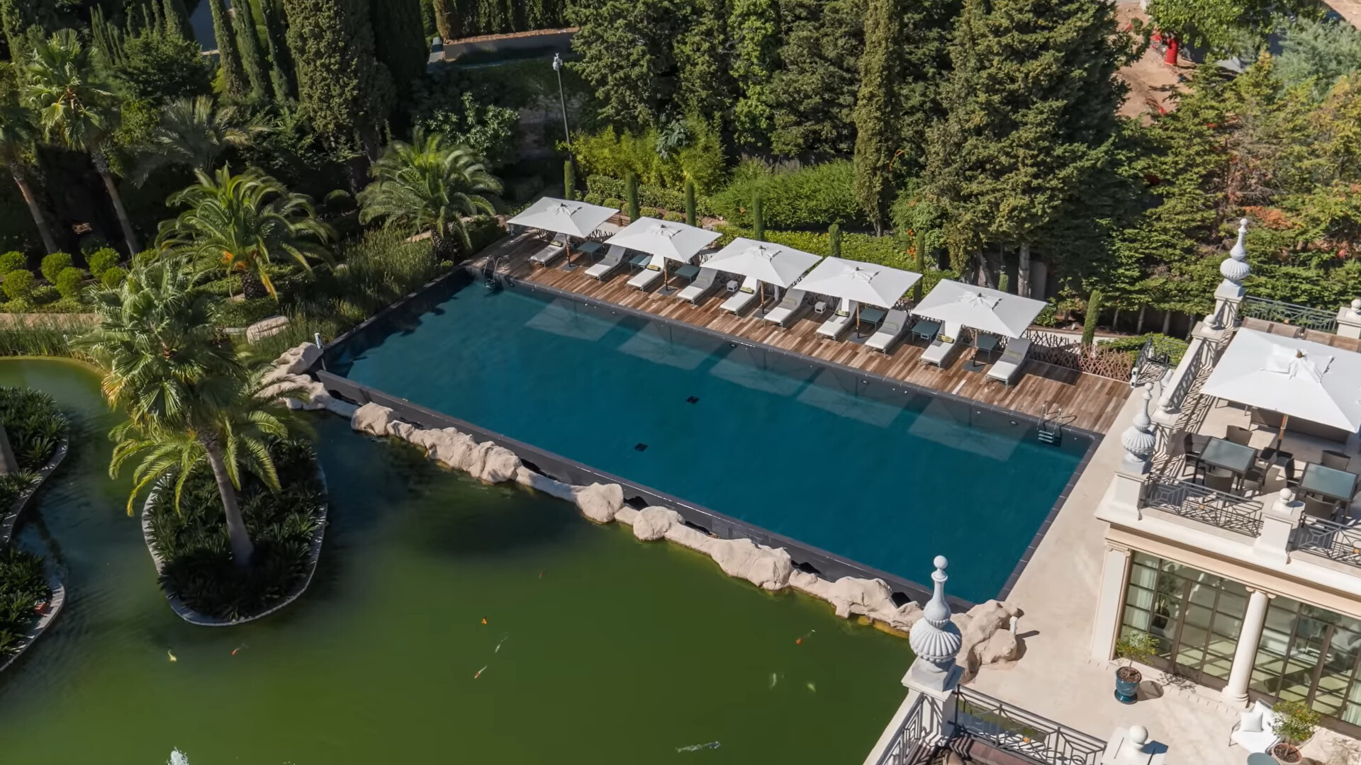 big outdoors pool with deck chairs