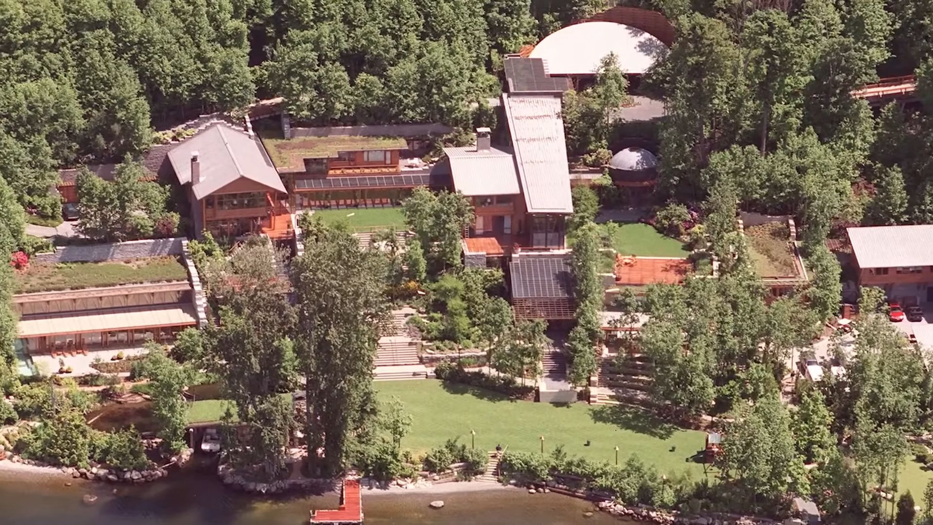 bill gates estate with lots of smaller buildings surrounded by woods and greenery