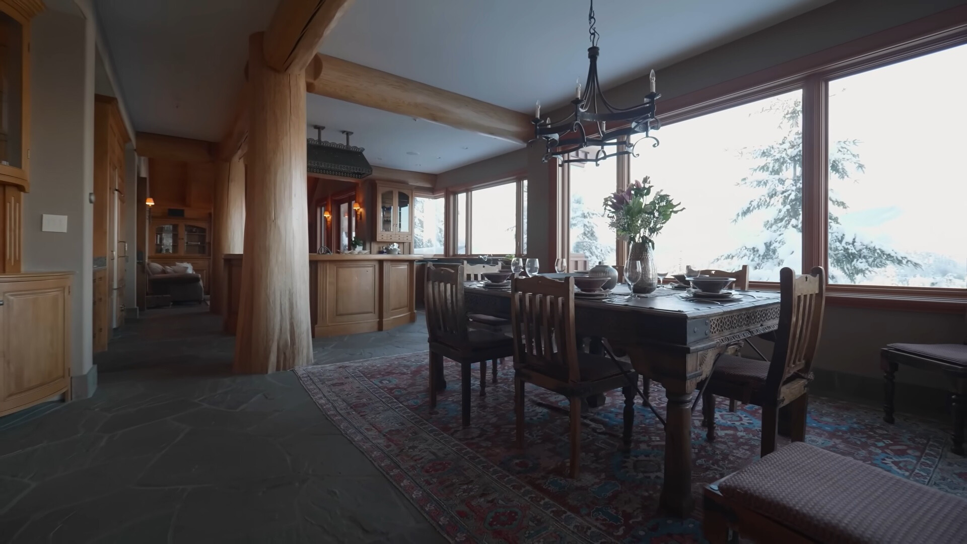 dining area with a brown dining table and six chairs and many windows