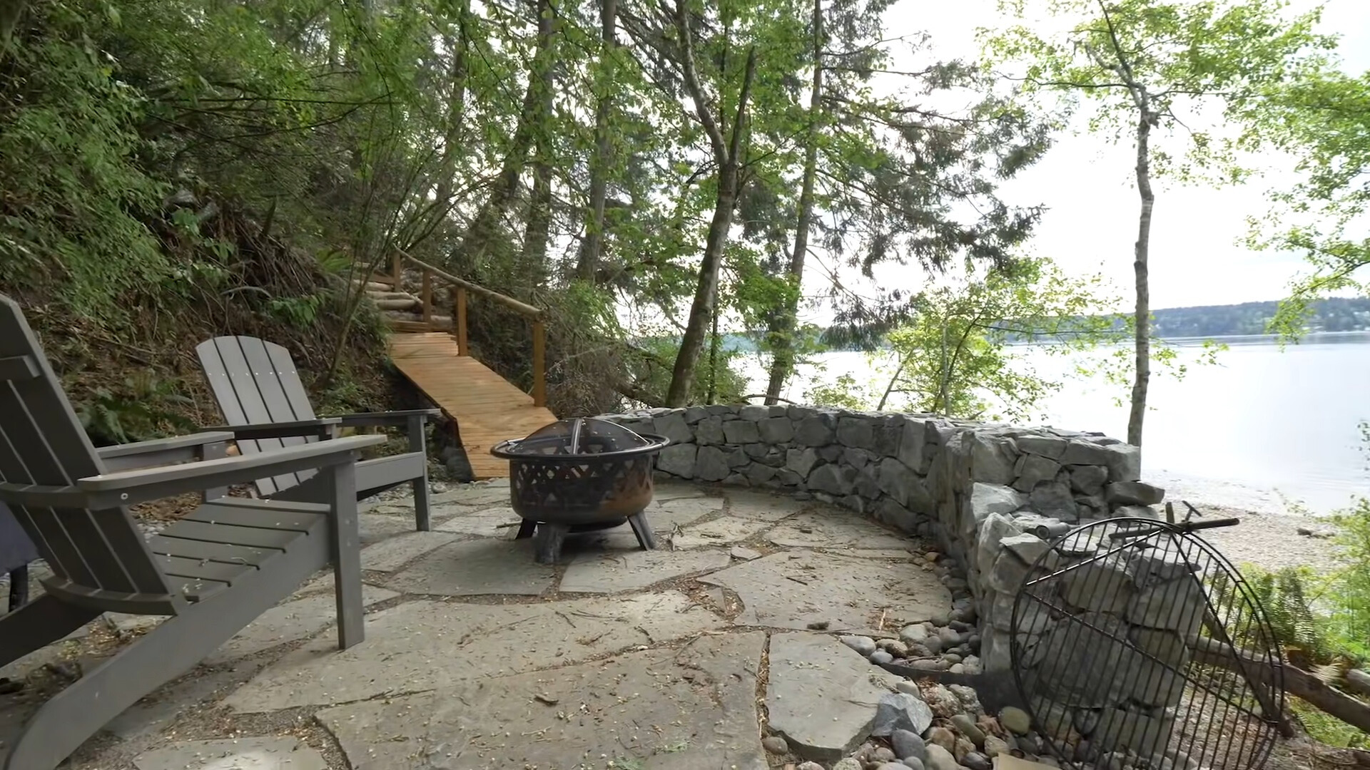 outdoors hangout area with two chairs and a firepit