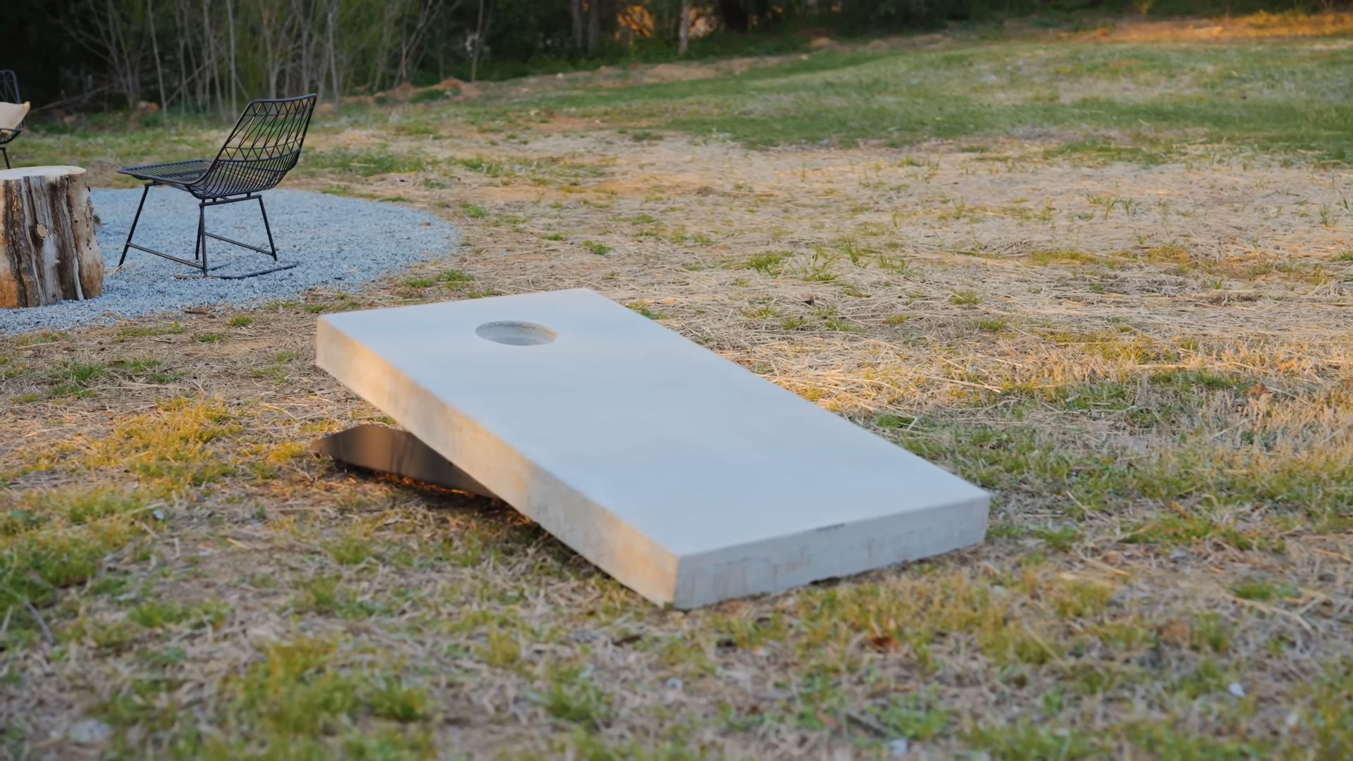 cement board for the corn hole game in the backyard