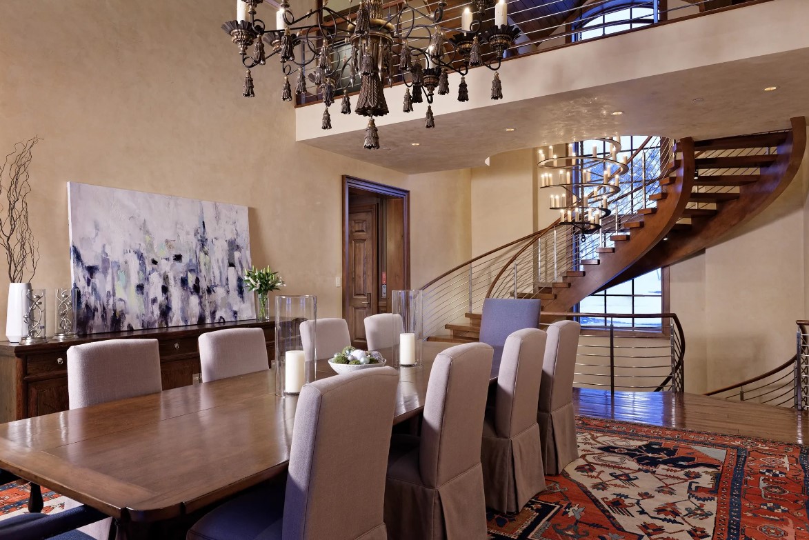 dining room with a big brown dining table and a chandelier above it