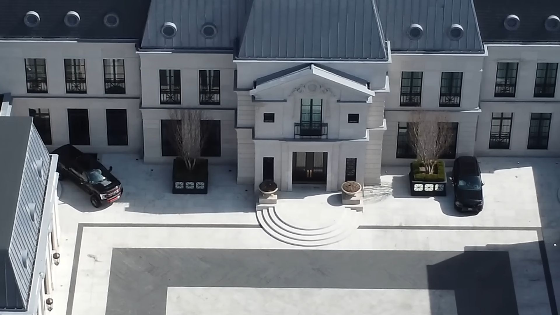 drake's modern mansion with a ton of windows, color palette in light grey