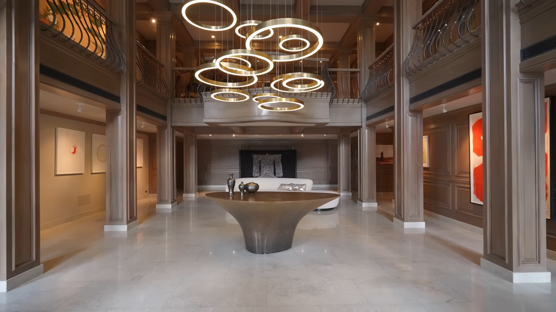 big chandelier and balconies inside of the house at the entry way