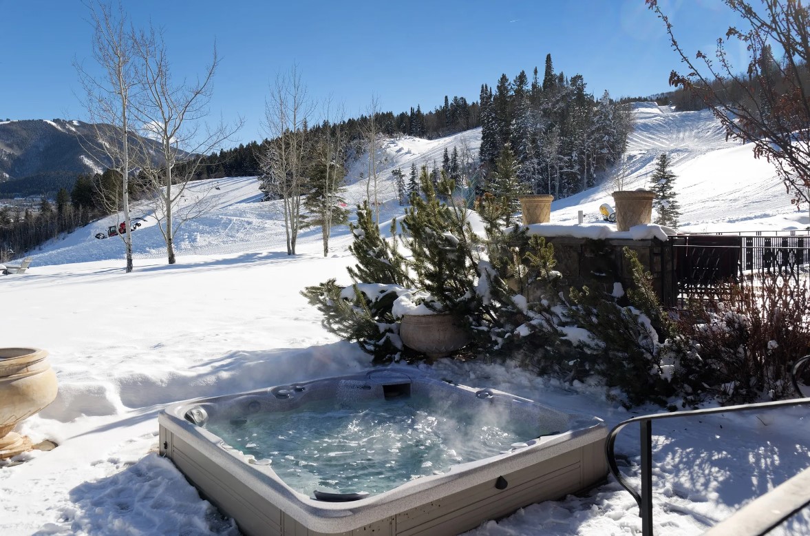 outdoors hot tub surrounded by snow