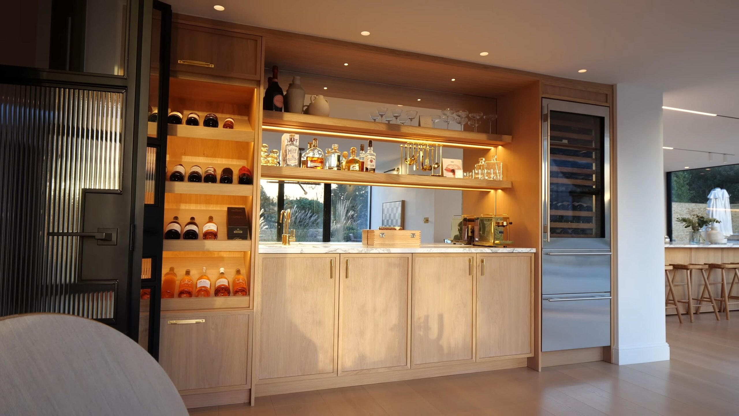 Indoor wooden bar with open shelves and LED lights