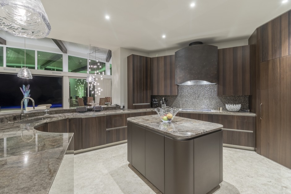 kitchen with a big countertop, brown cabinets