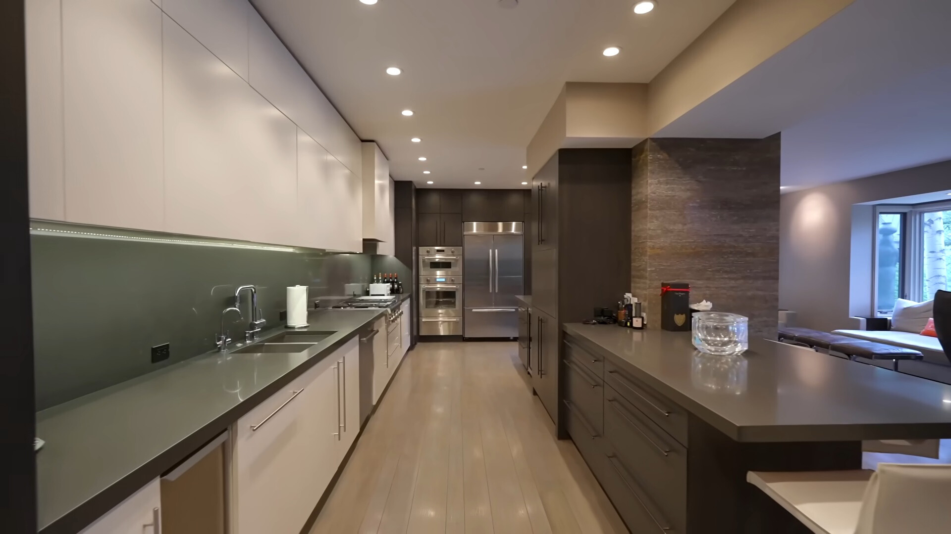 kitchen with white cabinets and a brown island