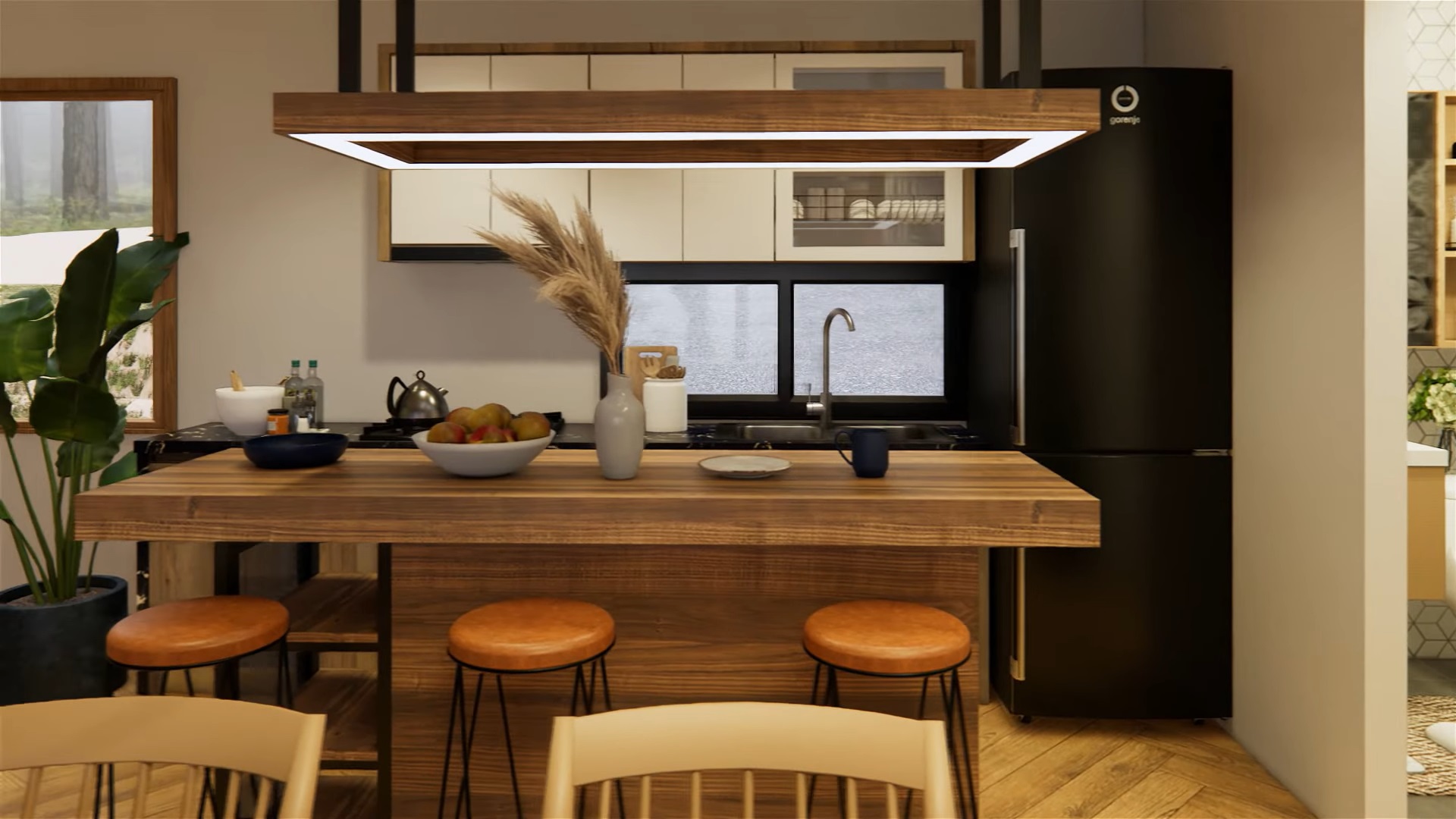 kitchen with a black countertop, brown, wooden island with three chairs, black fridge and white cabinets