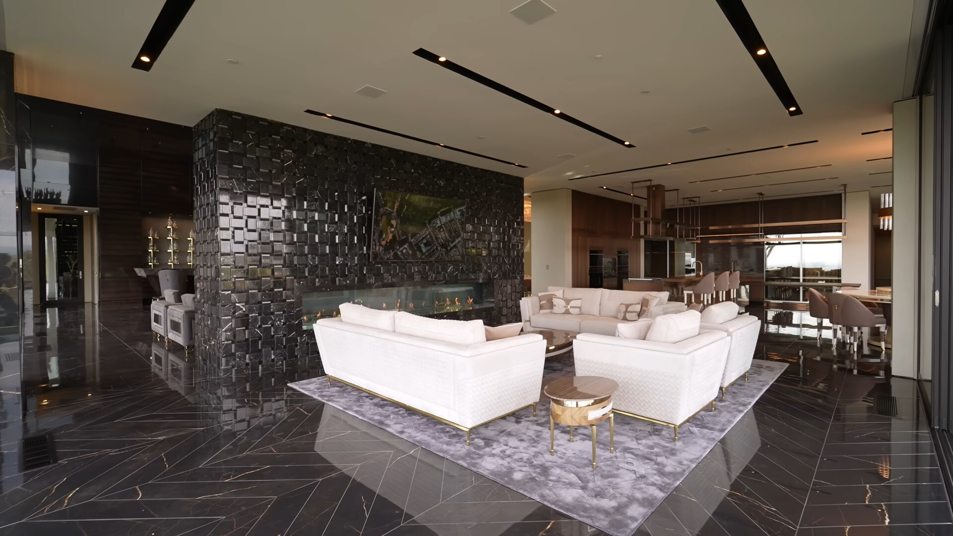 living room with white couches and a flat screen tv