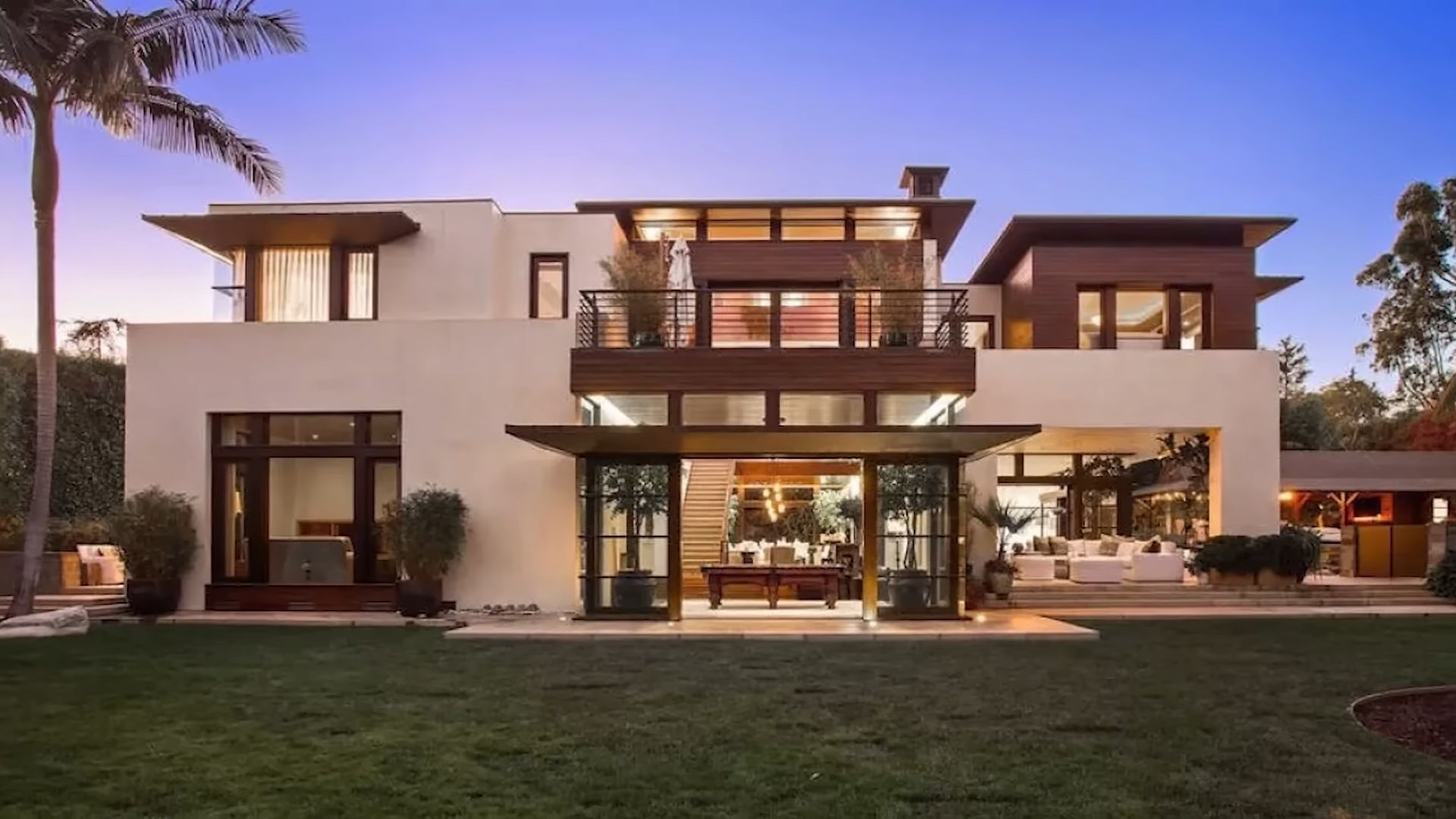 matt damon house with lots of glass walls, windows, color palette in earthy shades