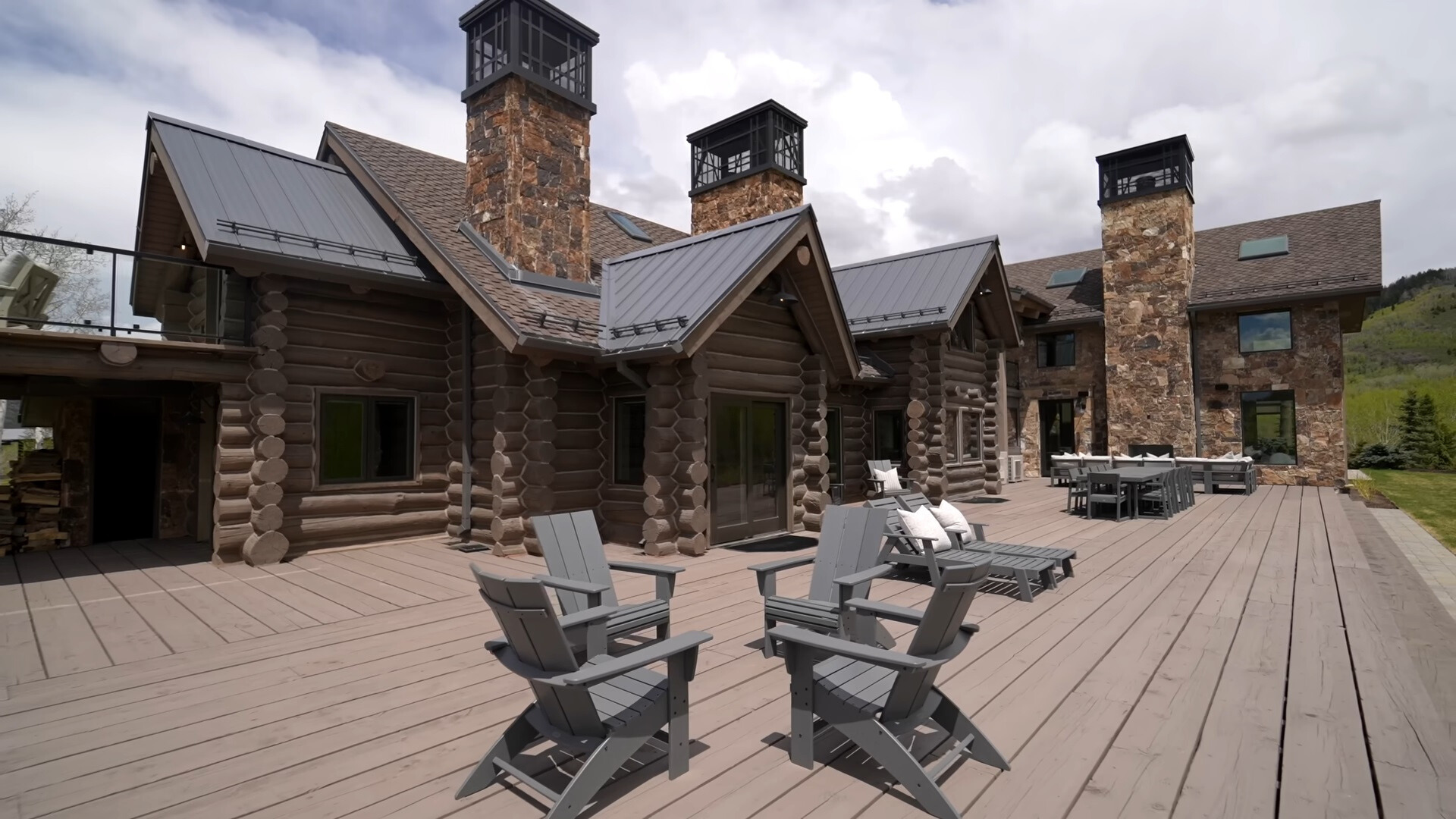 outdoors area with gray chairs, gray deck chairs and a gray dining table