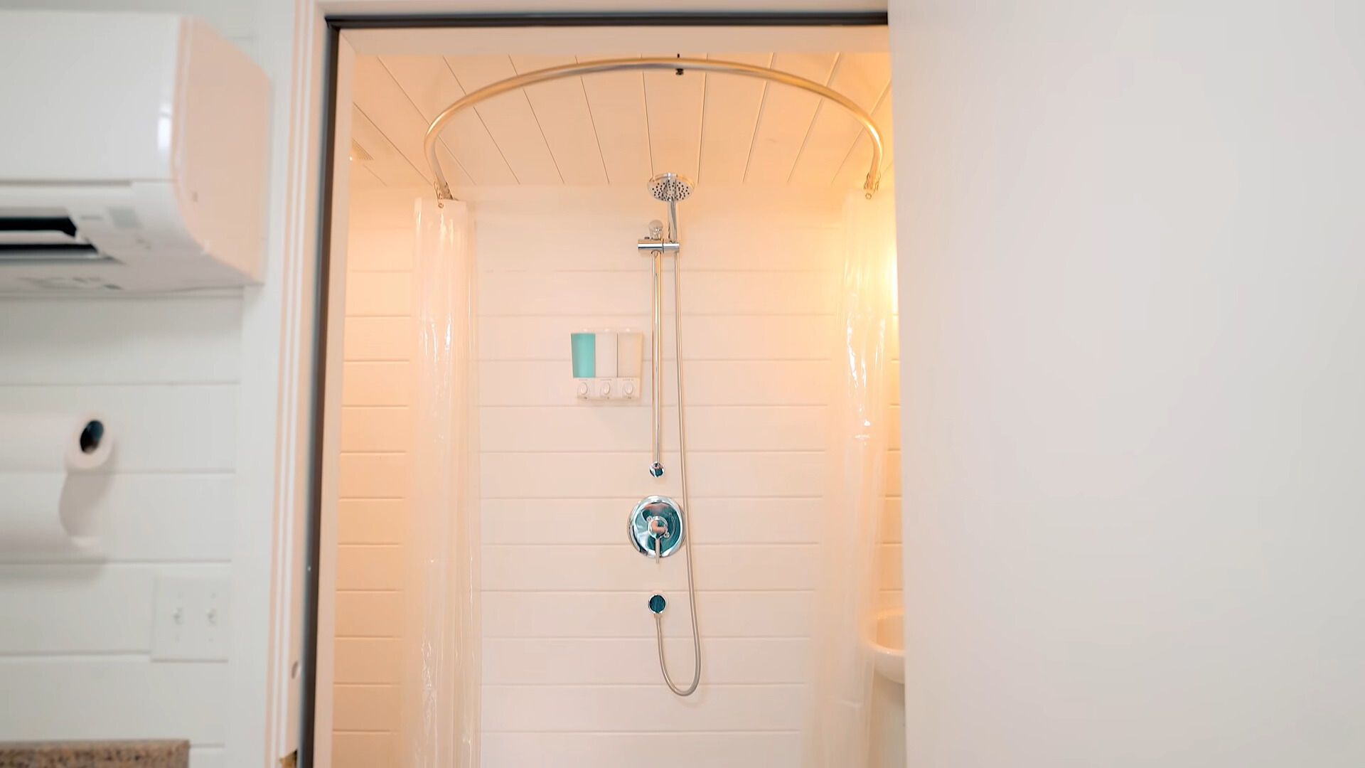 shower with curtains in the middle of the bathroom