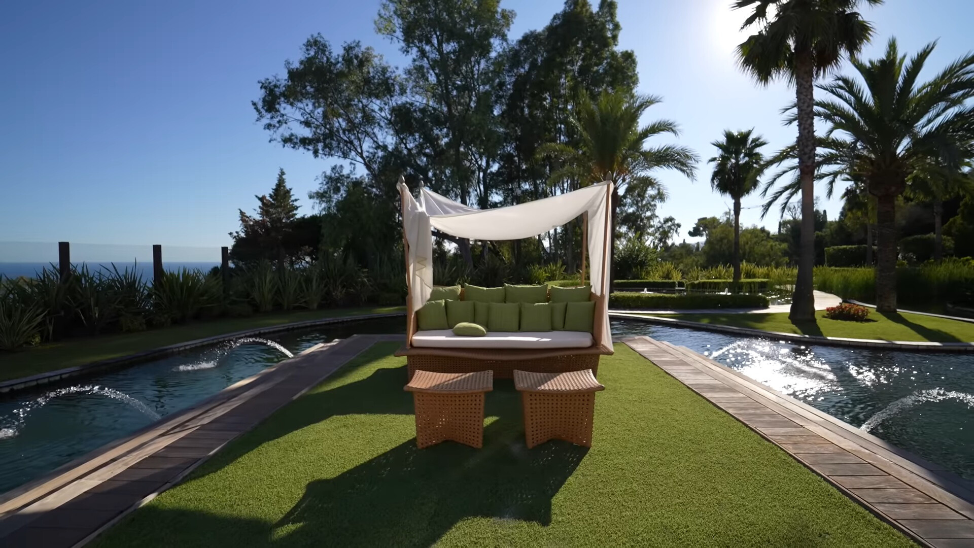 sitting area surrounded by a lake