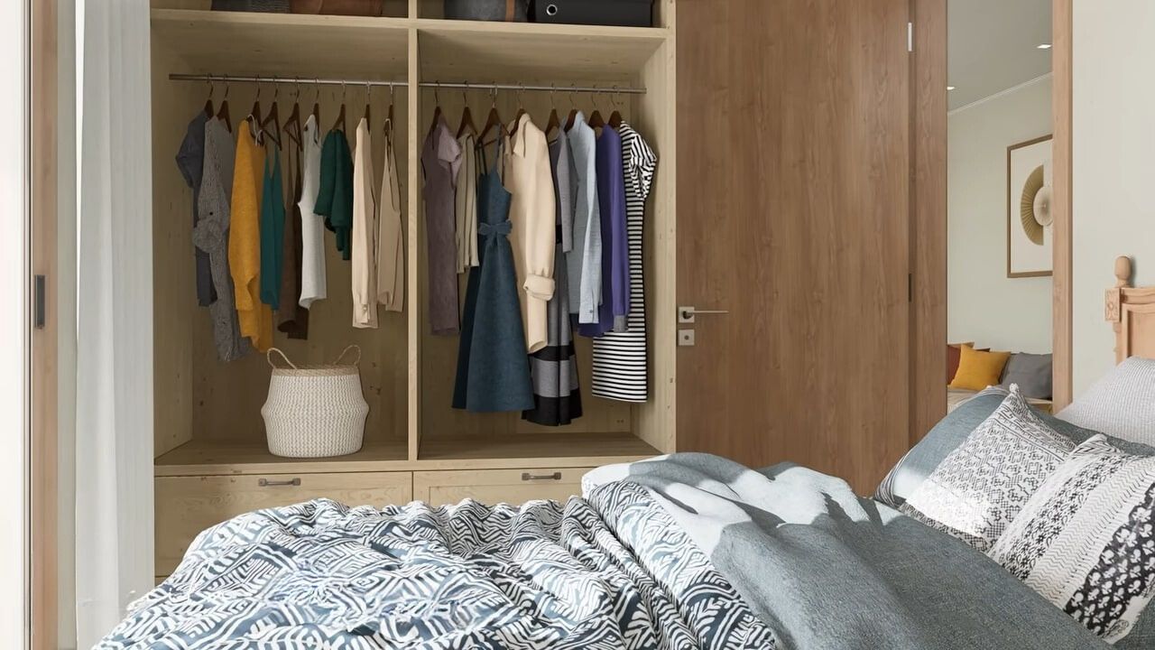 Small bedroom with large closet and colorful bedding