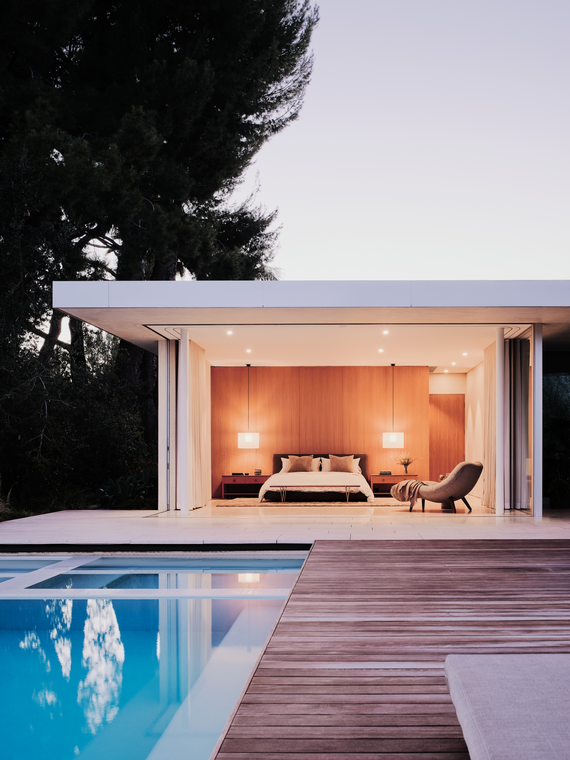 Stunning bedroom with a king-sized bed and a view on the pool