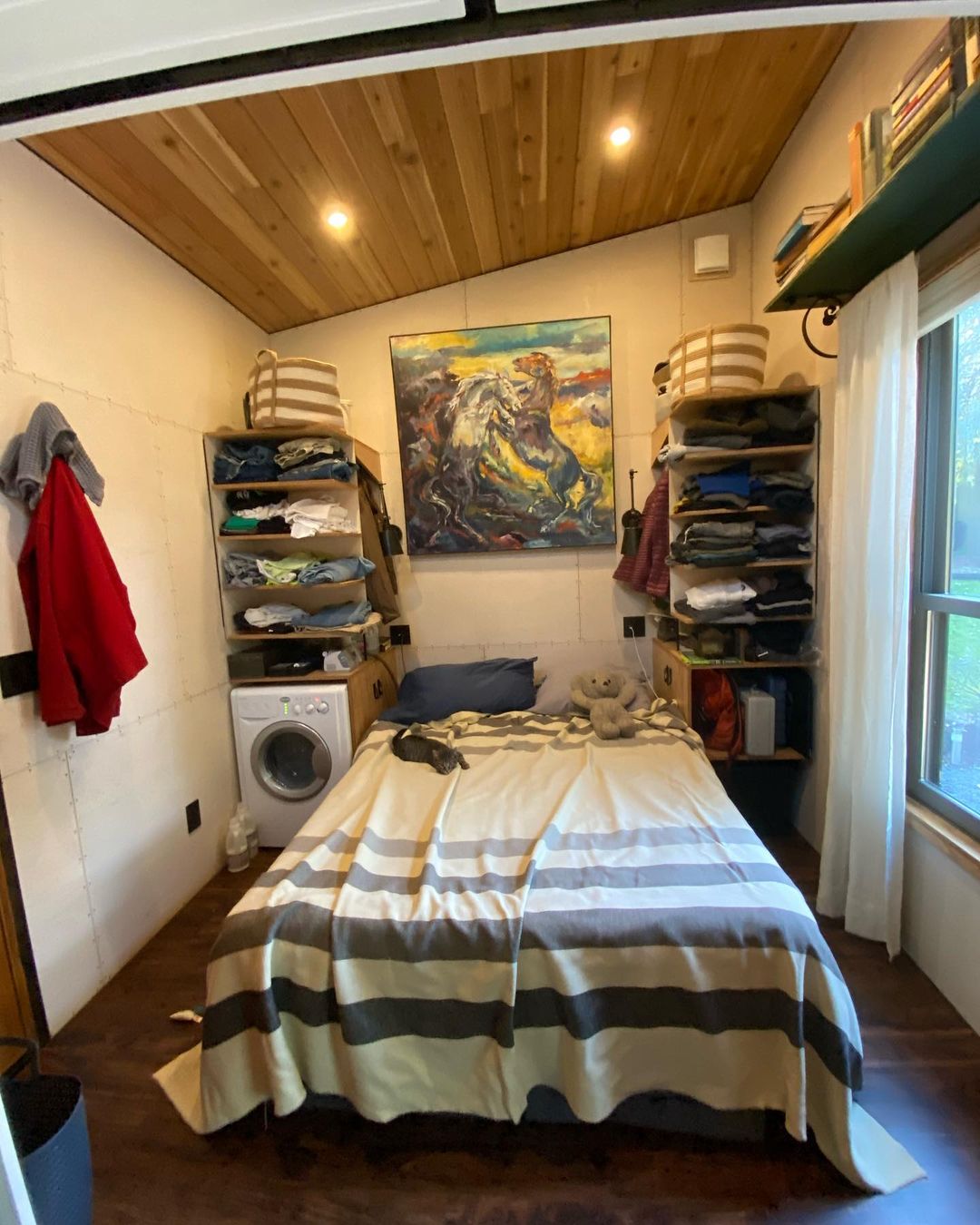 Bedroom with king-sized bed and floating shelves