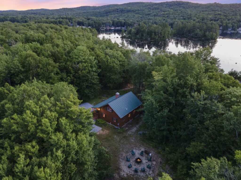 stunning cabin in the woods next to a lake