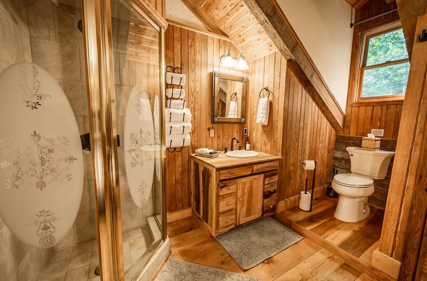 Cozy wooden bathroom with walk-in shower