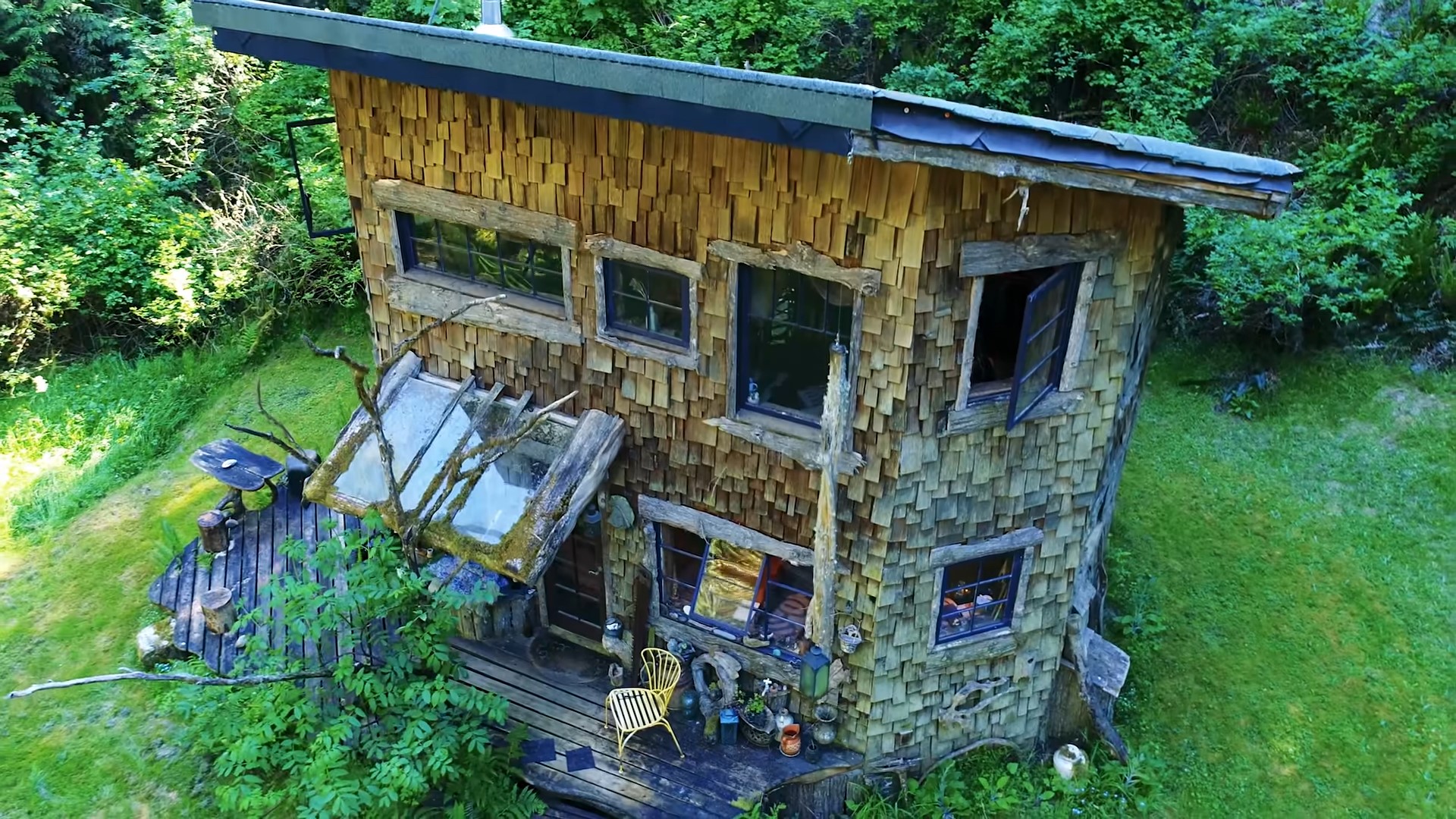 exterior of a wooden cabin with a circular design