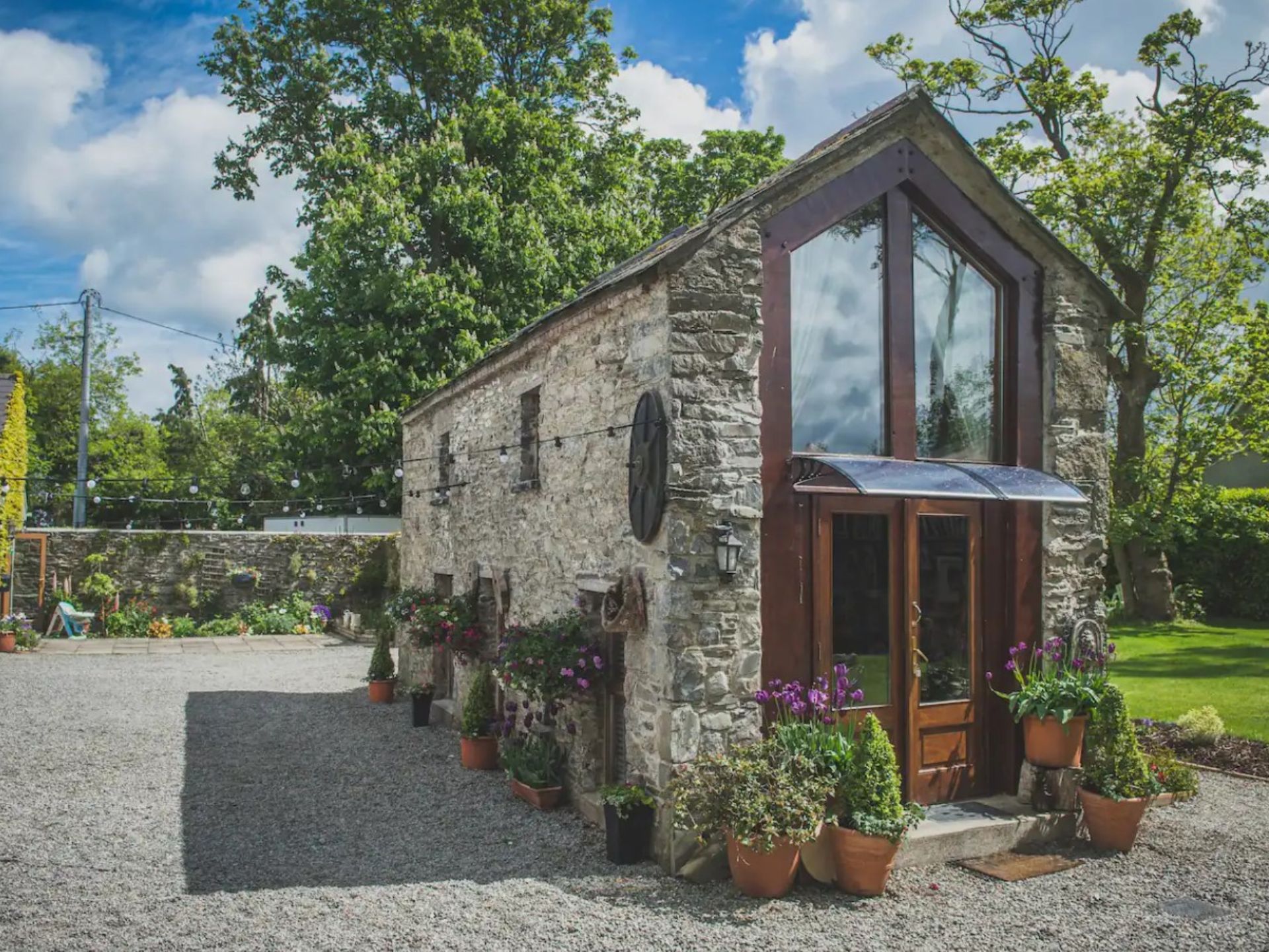 Tiny stone home with wooden front door