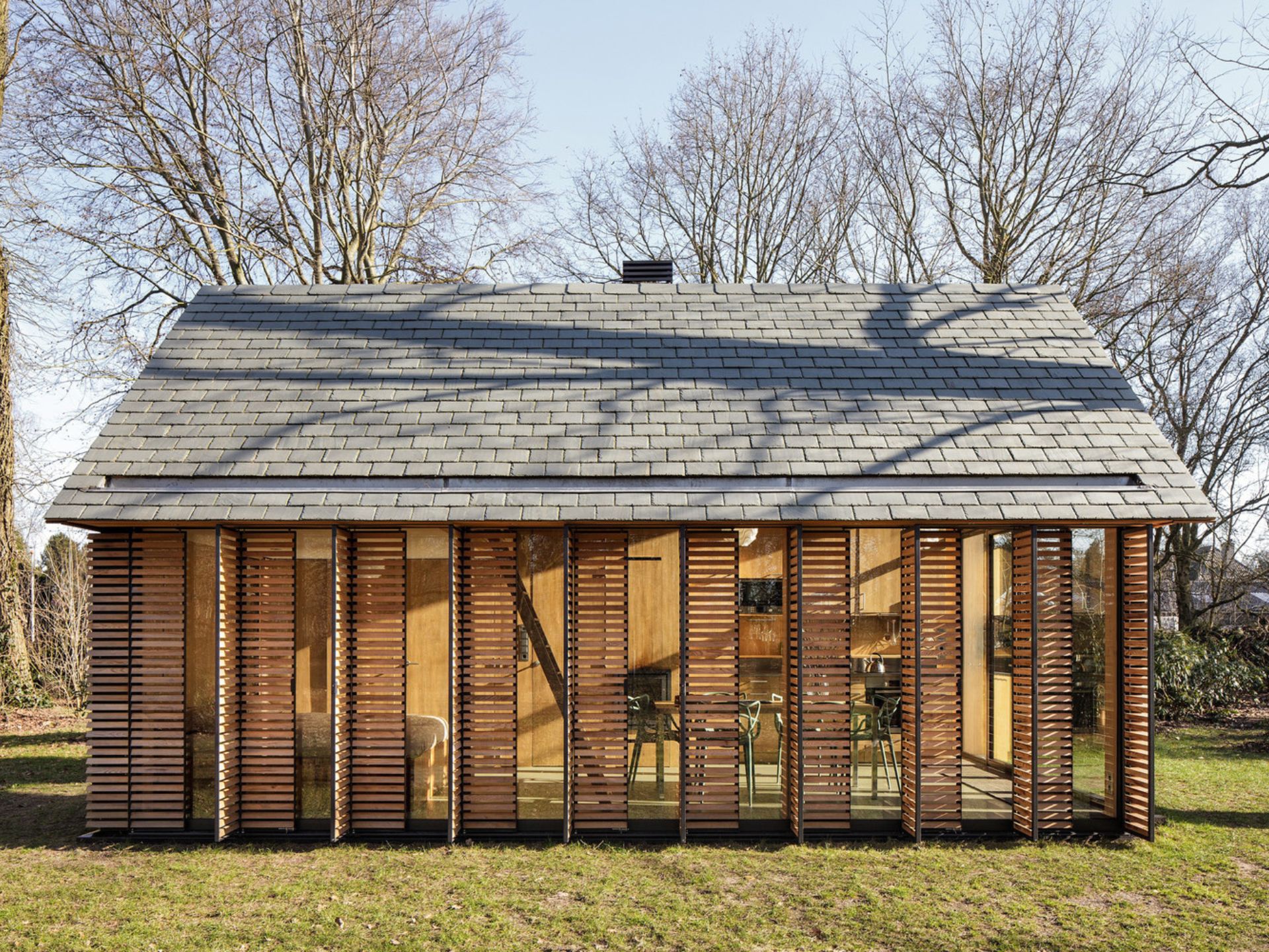 exterior of a cozy cabin with half opened wall