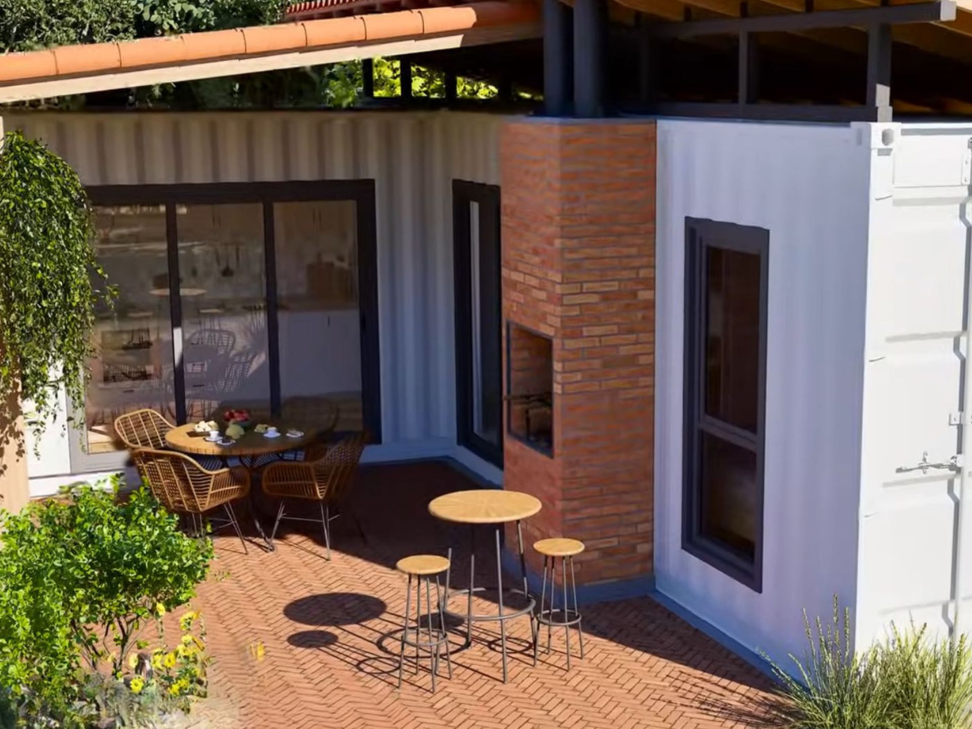 exterior of the container house with a nice patio, seating zones and a grill made of red bricks