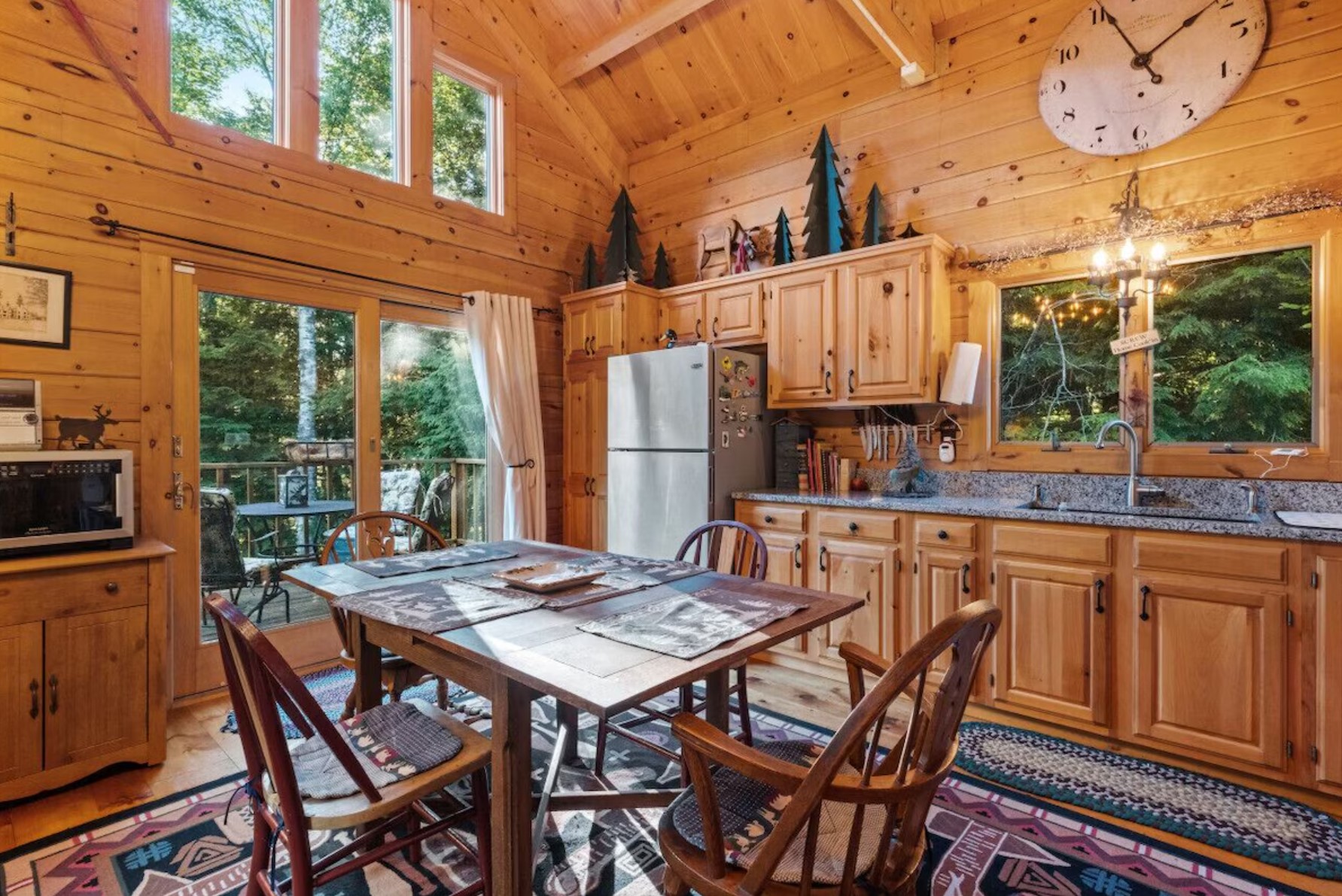 Wooden kitchen with a dining table and stunning decorations