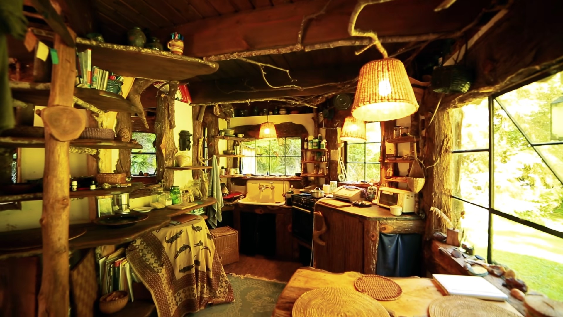 Magical kitchen with exposed wooden shelves and big windows