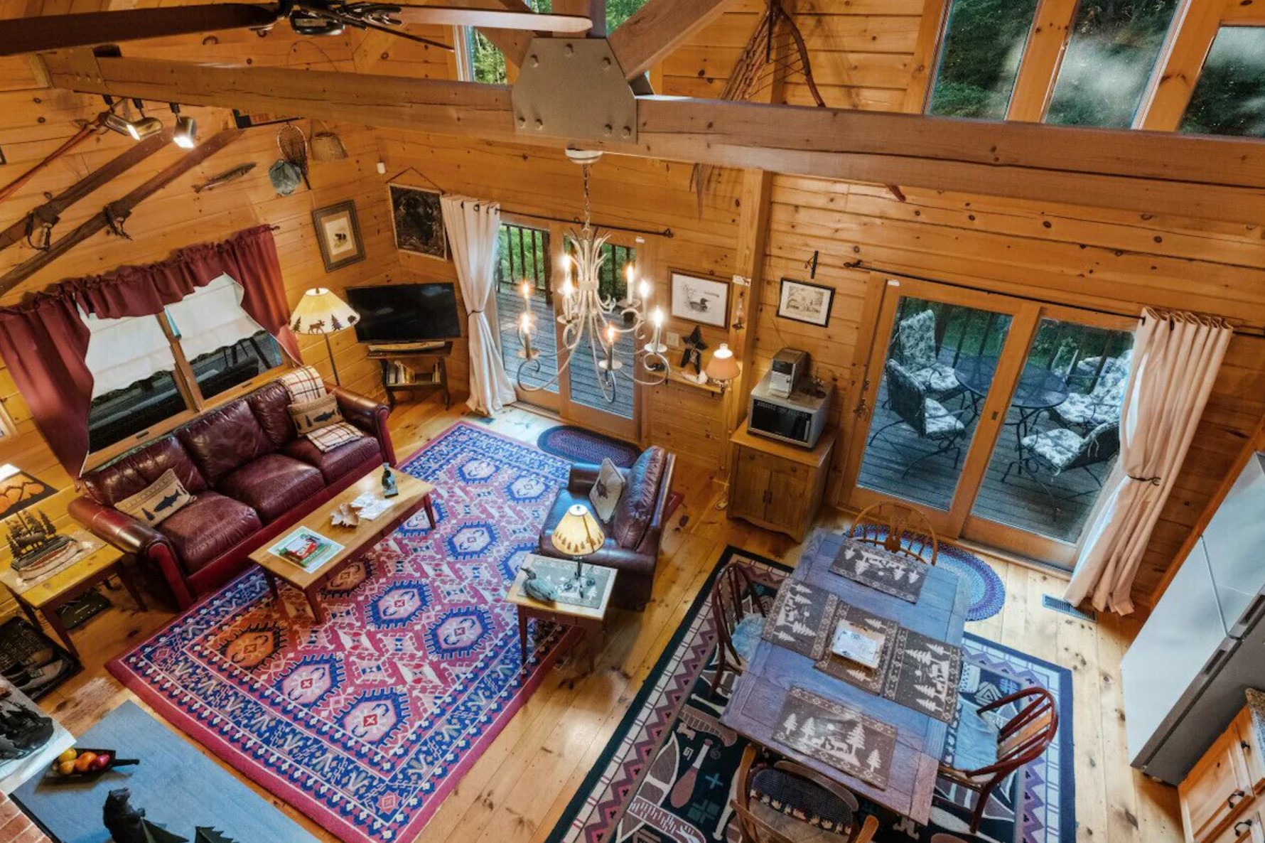 Living room with red rug and leather couch