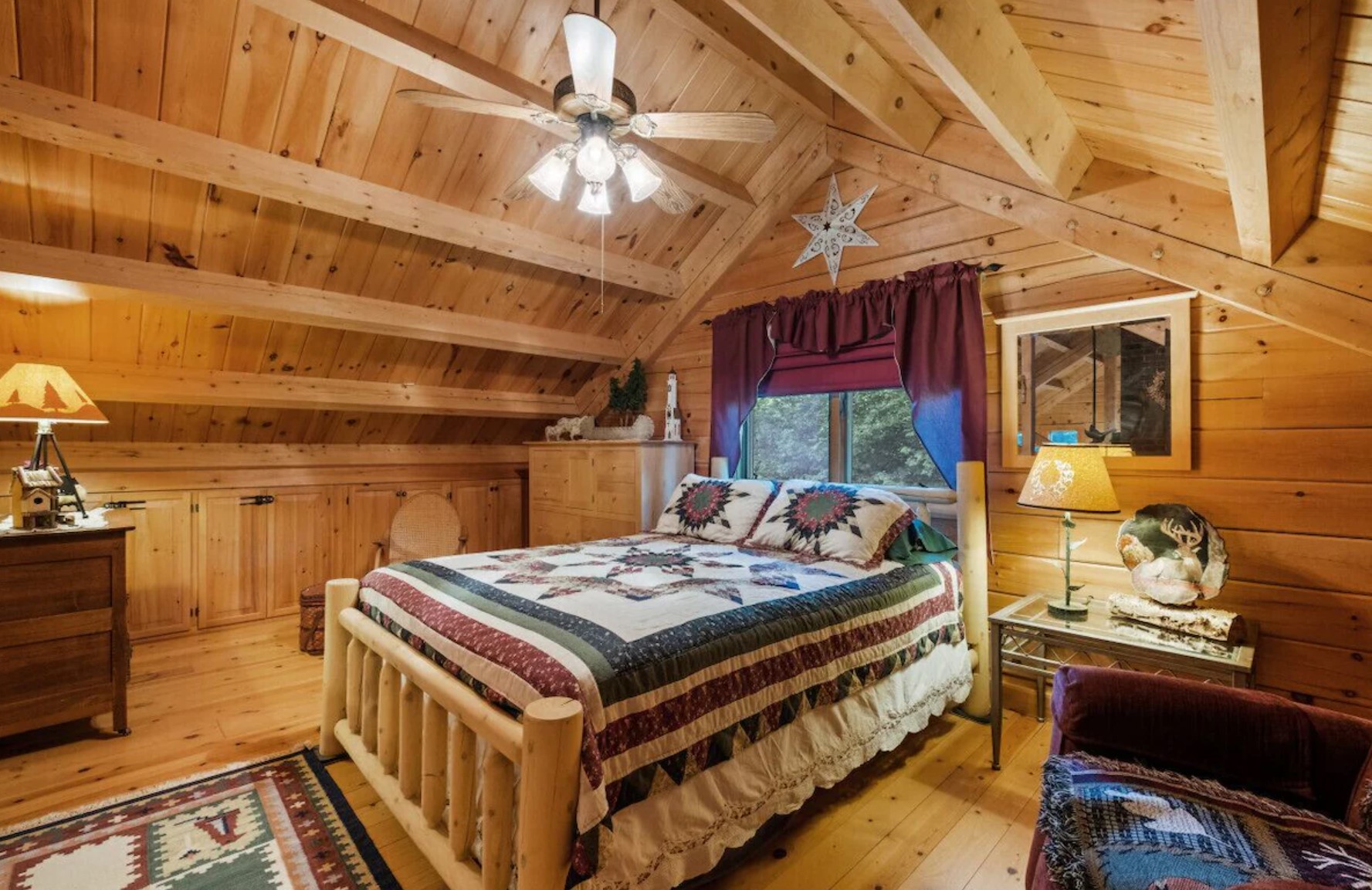 Master bedroom with a window and a wooden bed frame