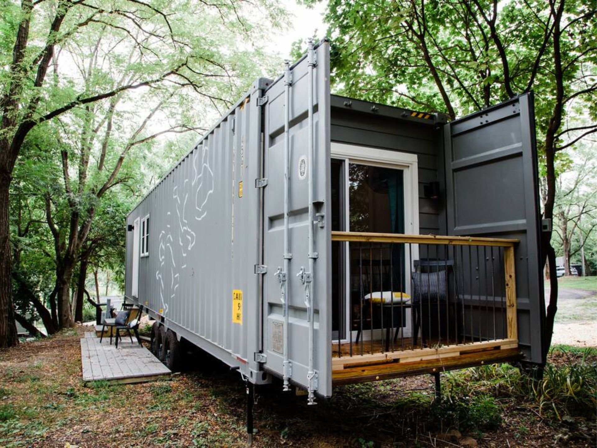 Container home on wheels with a porch