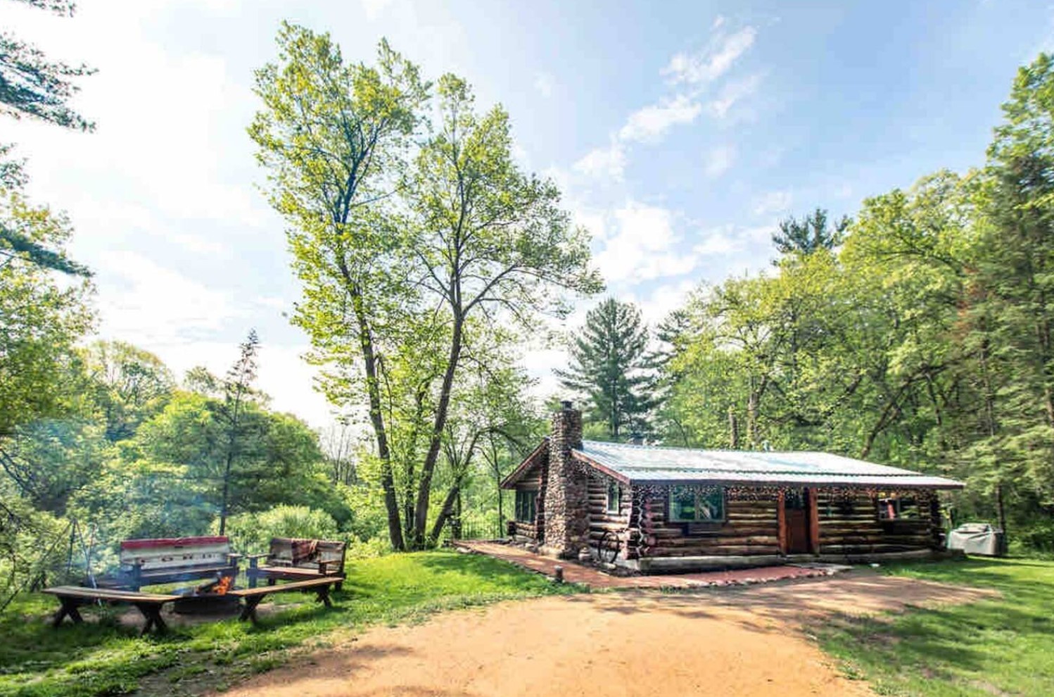 Wooden cabin in nature with a firepit