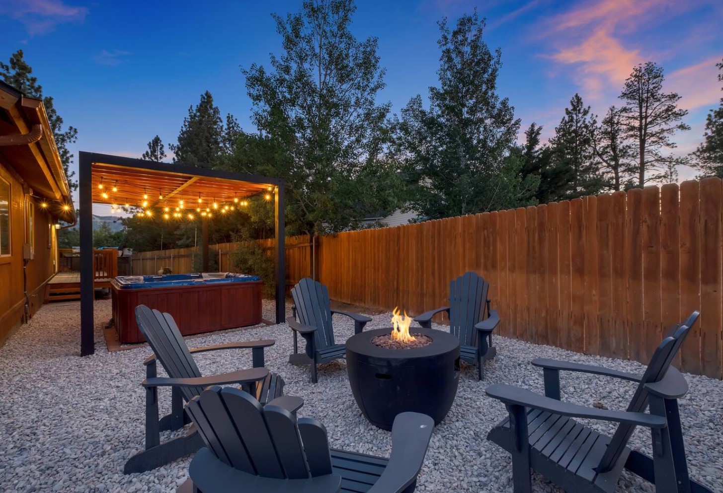 Backyard with hot tub and firepit