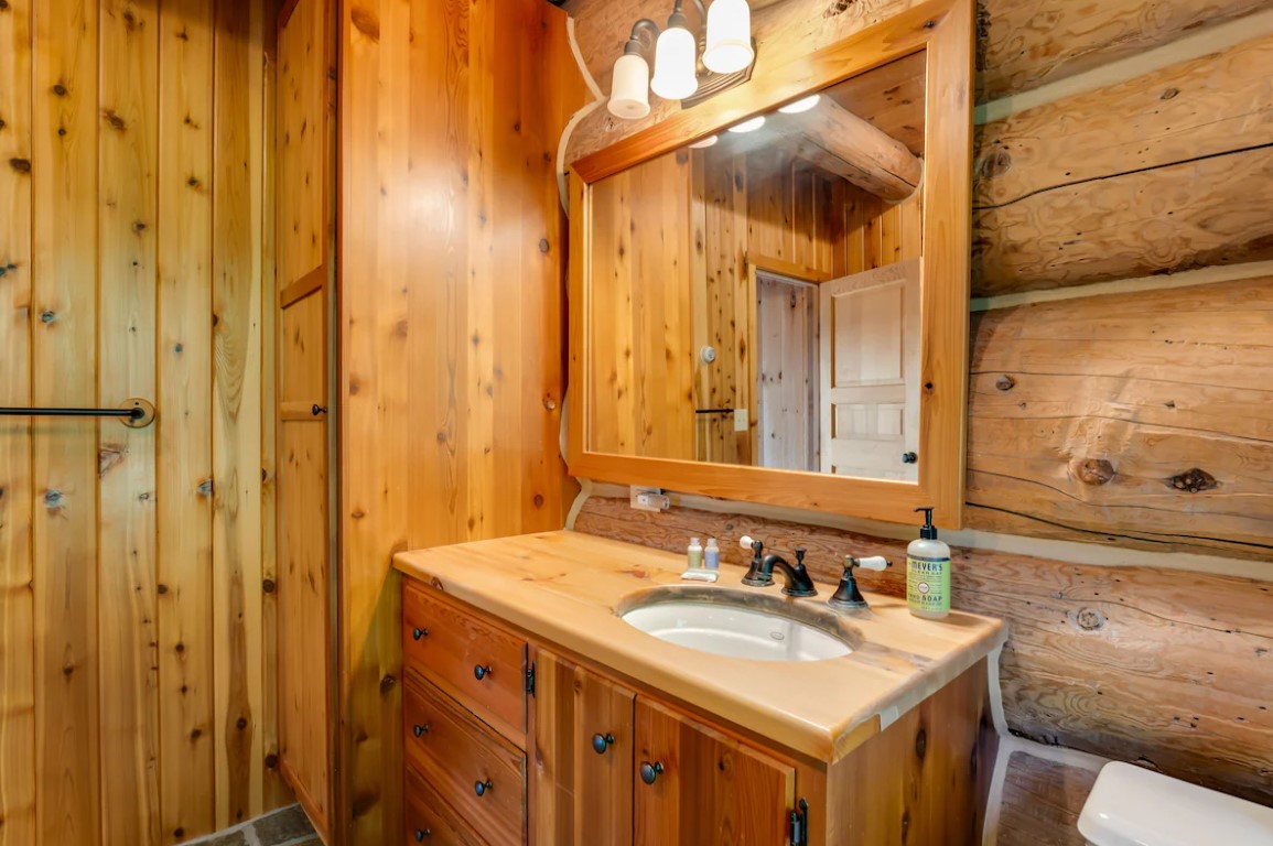 bathroom with wooden cabinets