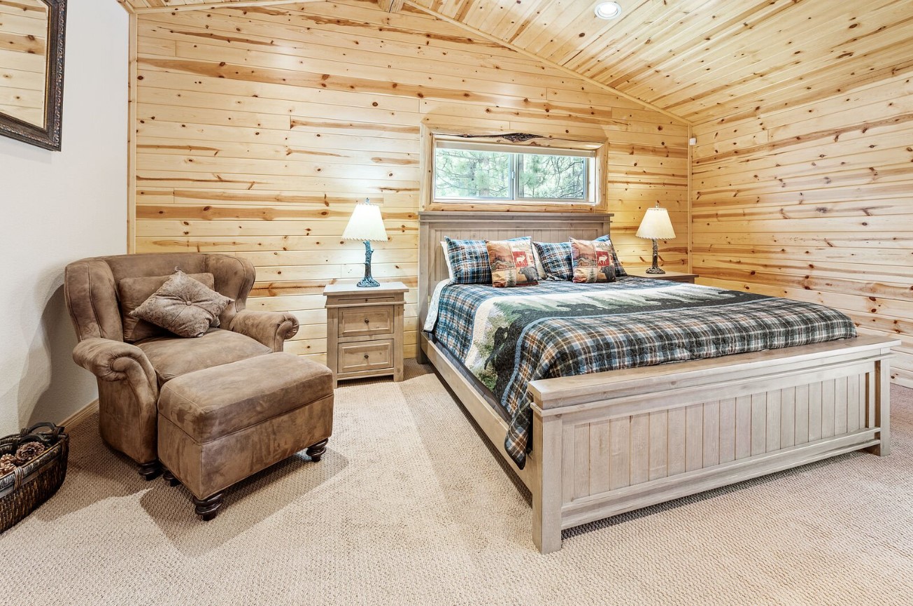 bedroom with a brown sofa in the corner and brown walls