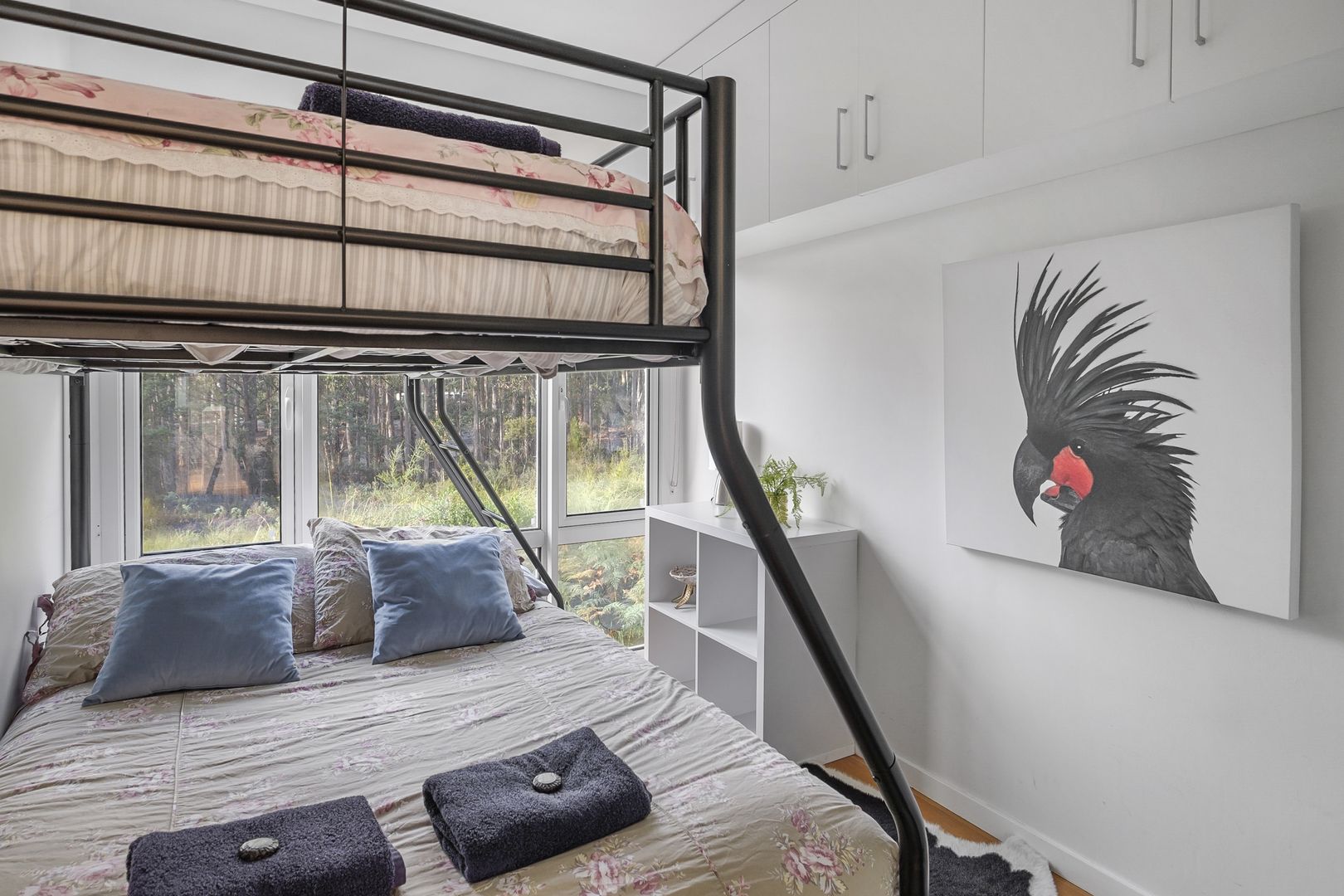 bedroom with a bunk bed and a floor to ceiling window