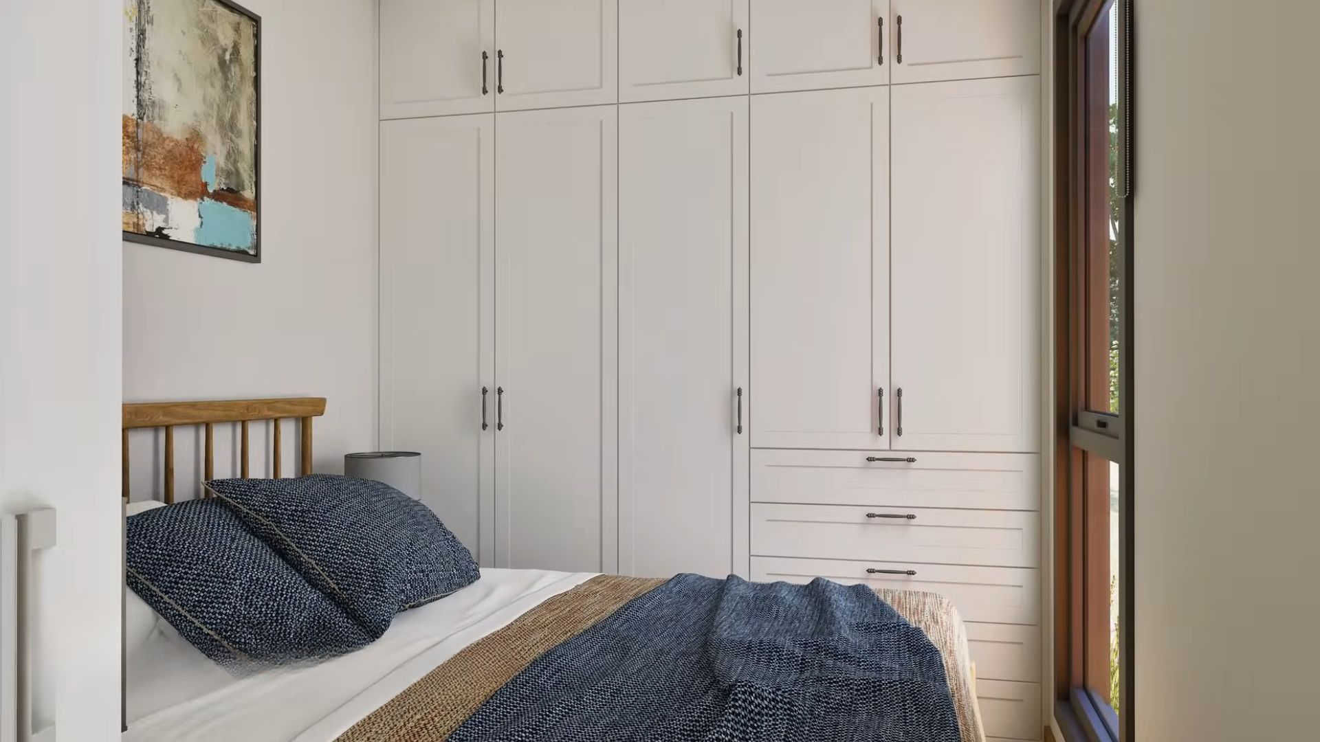 simple bedroom with a wood frame bed, blue bedding, and a big white closet by the bed, window before the bed