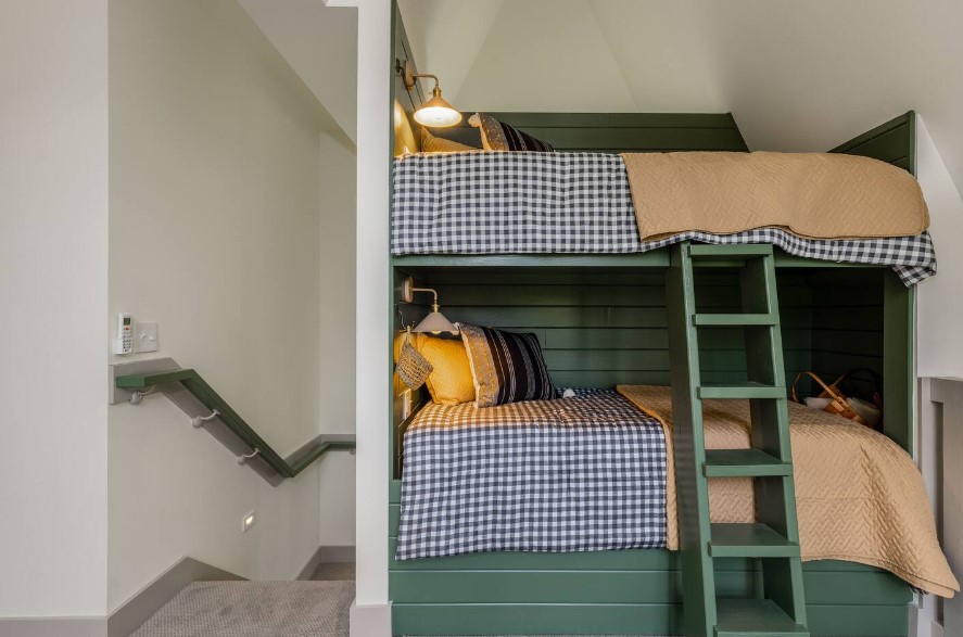 bedroom with bunk beds with each having its own mini lamp