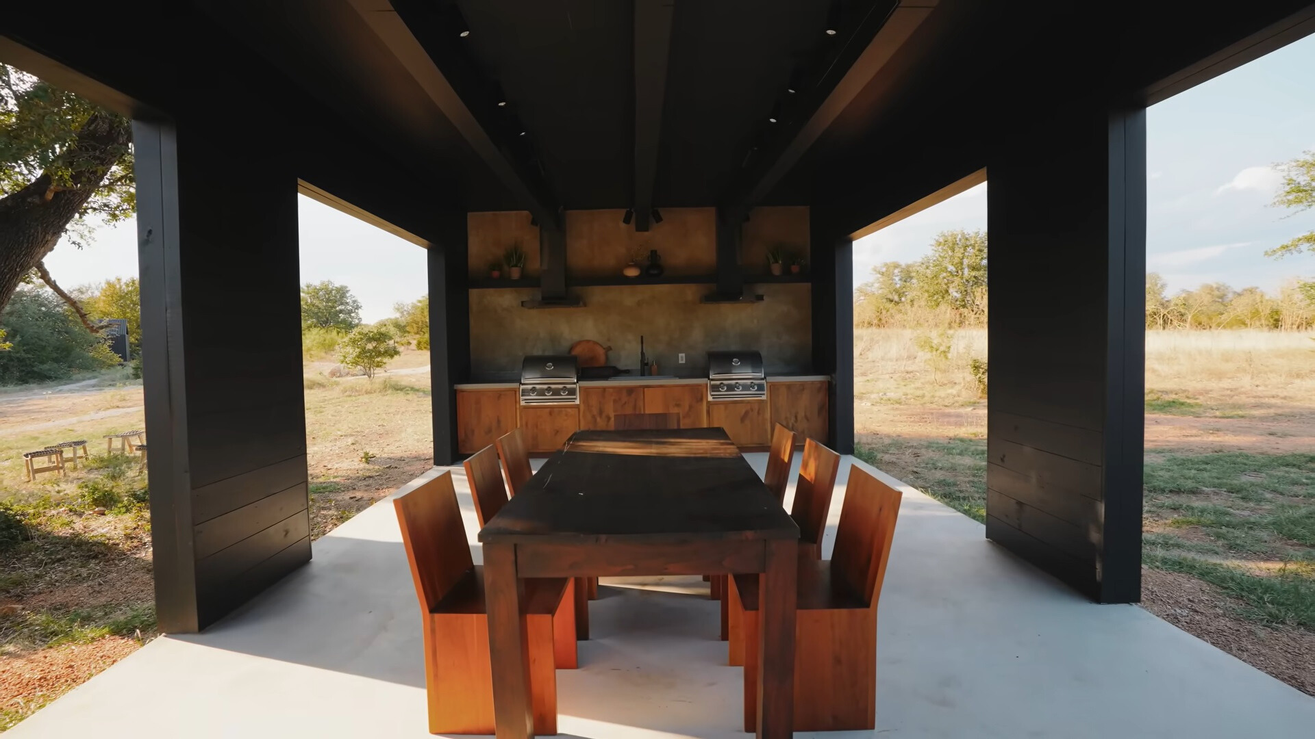 community area with a big kitchen and a big brown dining table