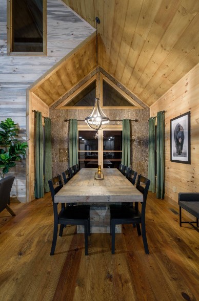 dining room with a long dining table and black chairs