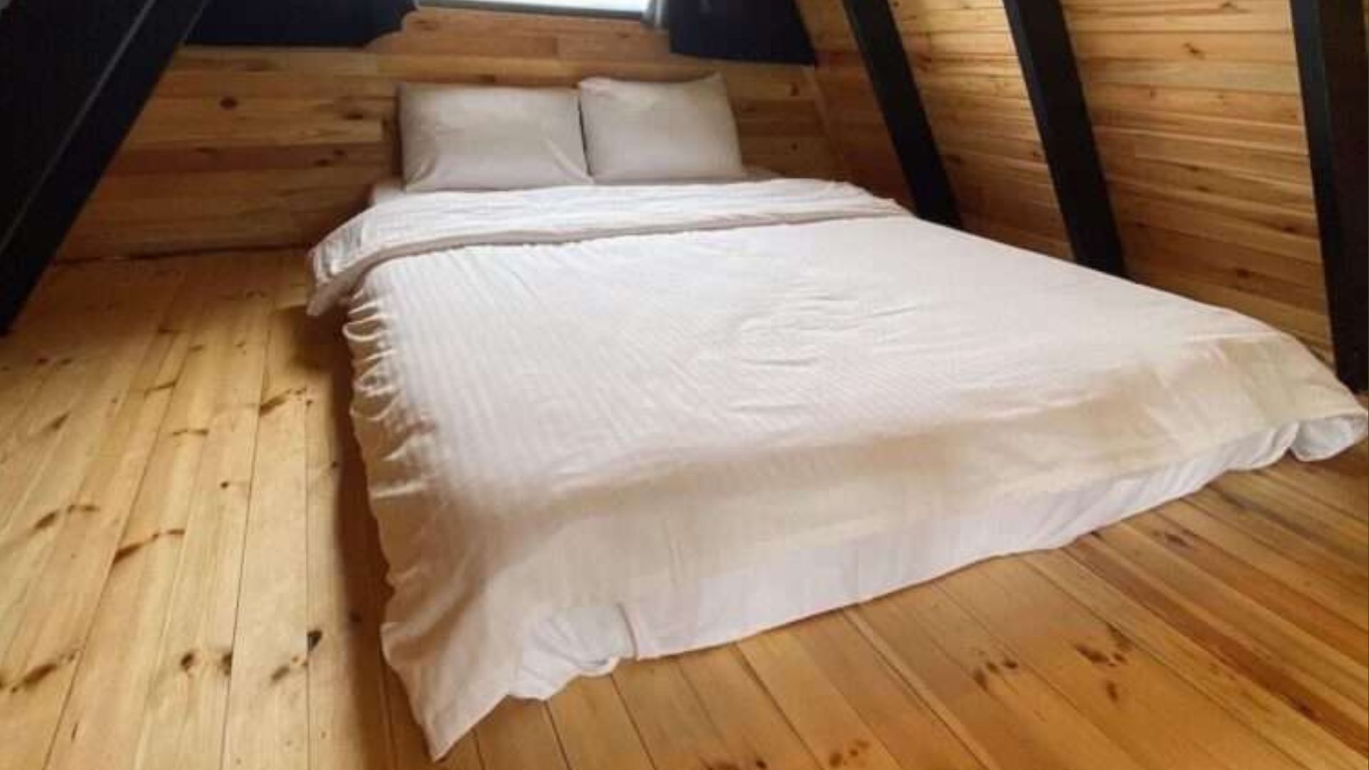 floor bed up on the bedroom loft, white bedding