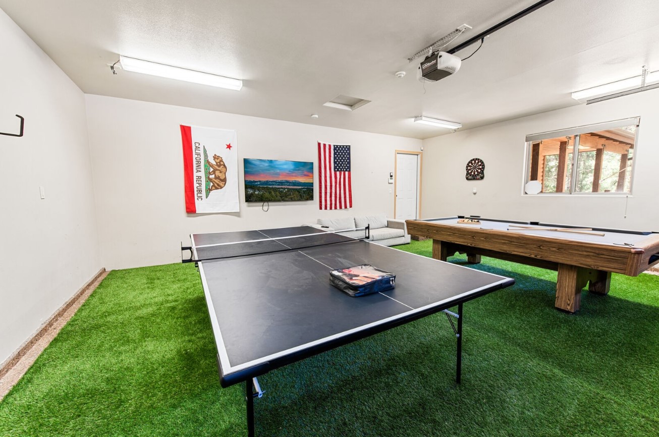 room with a pool table and a tennis table