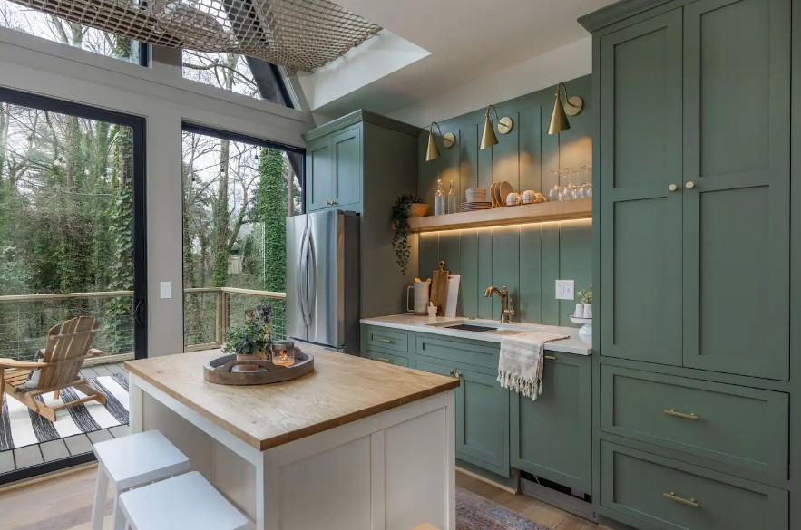 green cabinet of the kitchen, brown shelf and brown countertop of the island