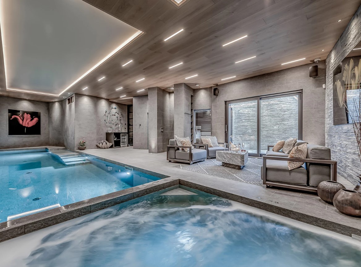 indoors pool and a hot tub and a couch