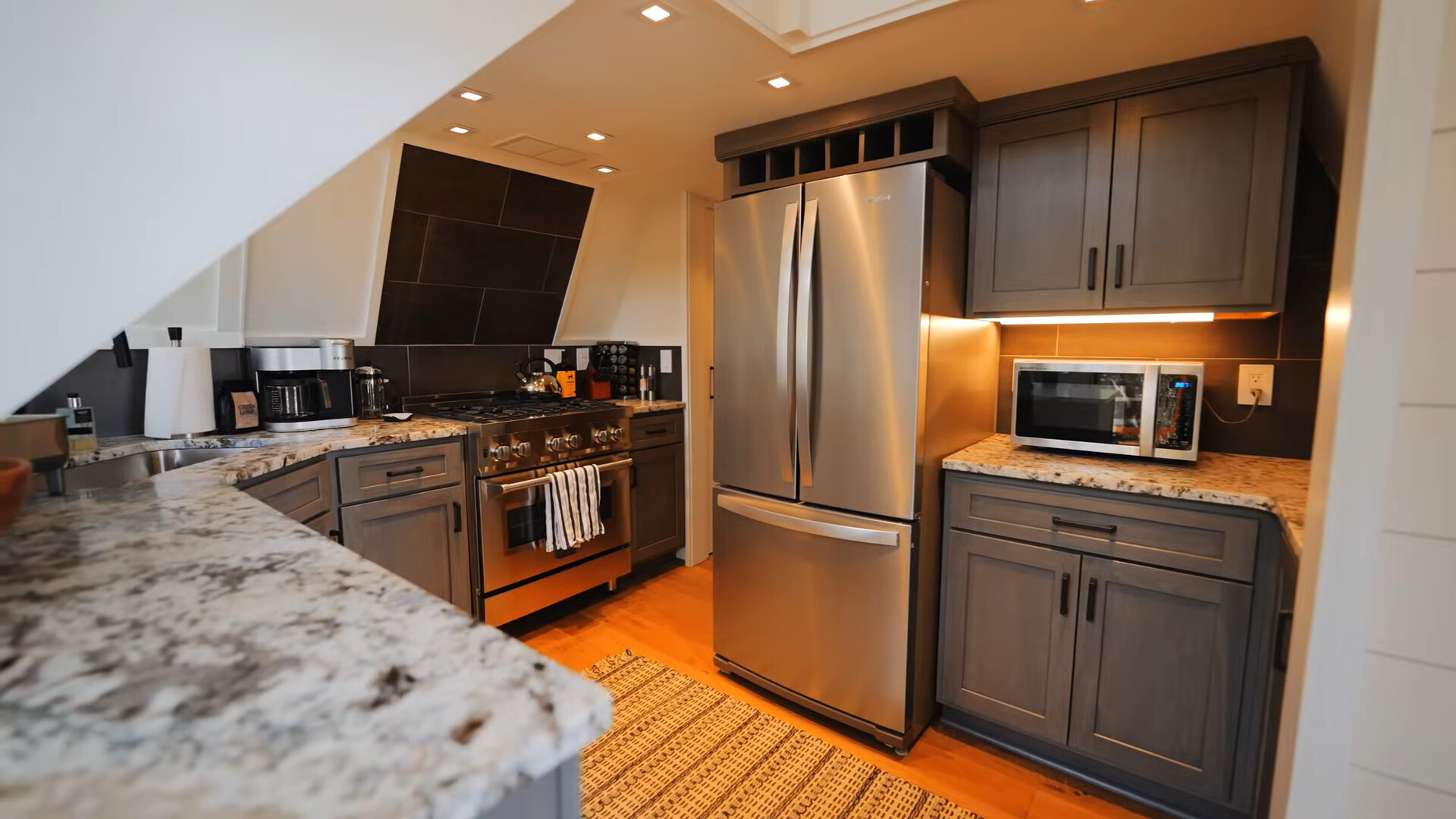 kitchen with gray cabinets and a big fridge