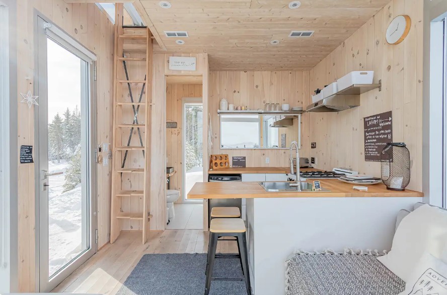 kitchen with light brown walls, U-shaped countertop, white cabinets