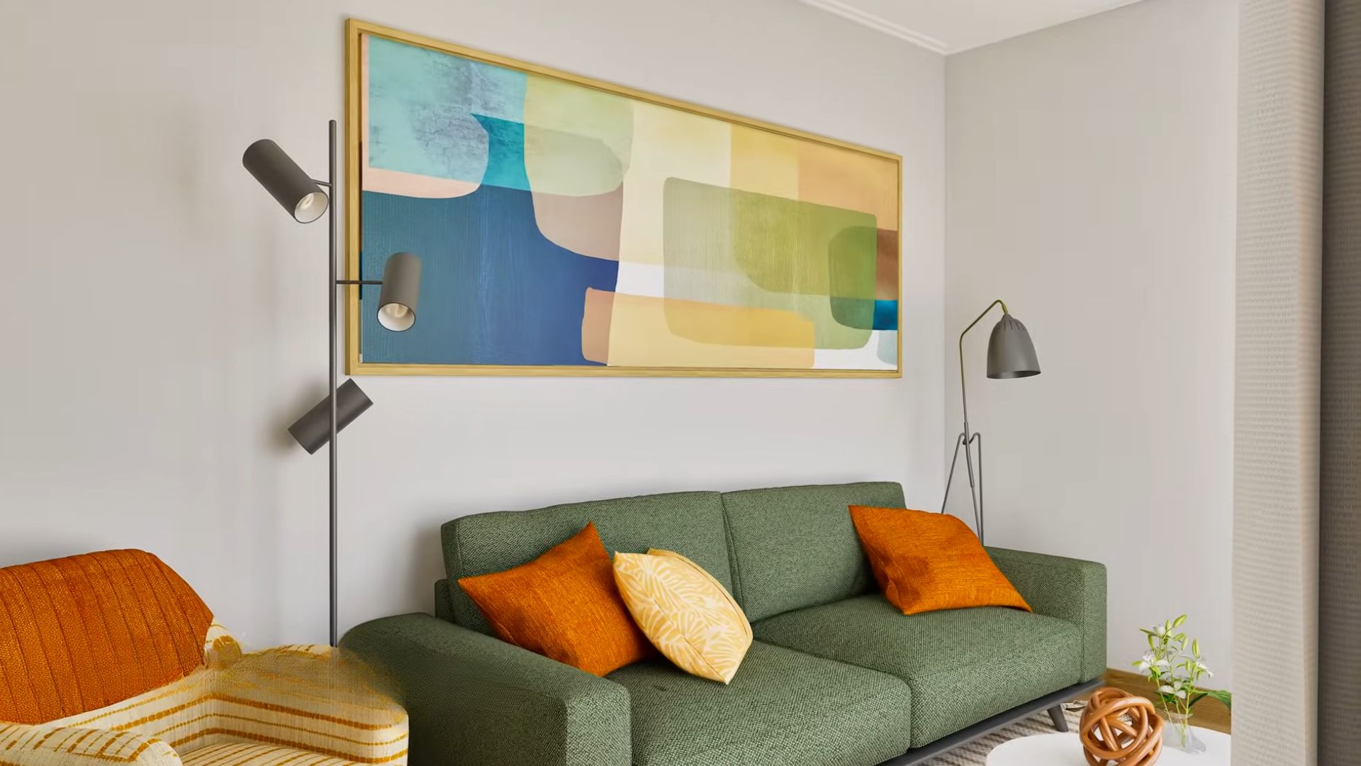 colorful living room with a gree sofa, orange and beige throw pillows, an armchair on the left, and a vivid painting above the sofa